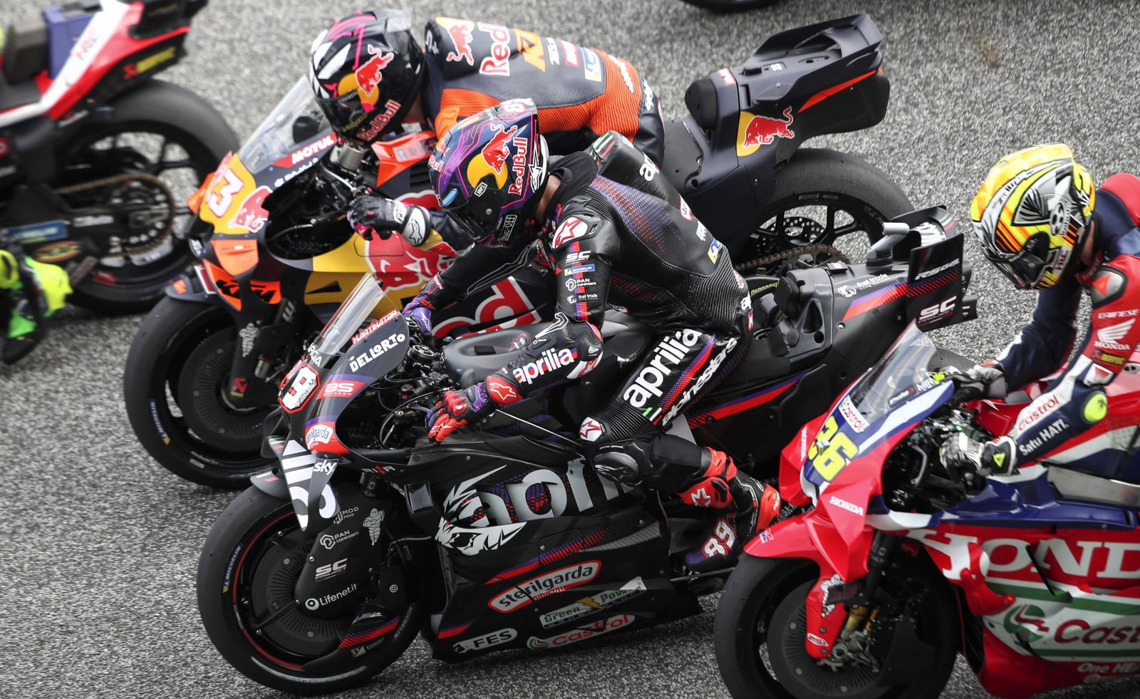 Aprilia, KTM, Honda MotoGP machines.