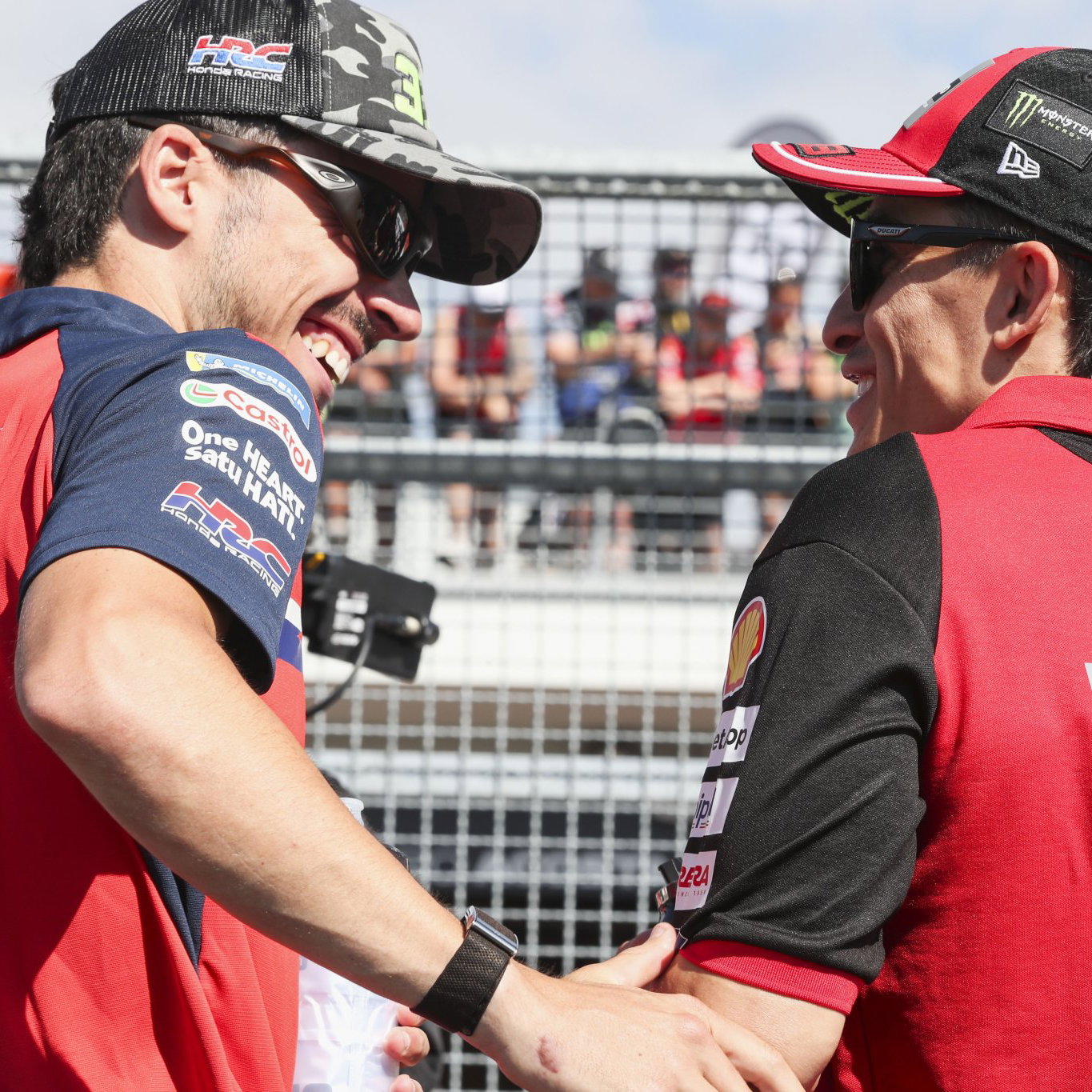 Joan Mir speaks with Marc Marquez in pit lane at the 2026 MotoGP German Grand Prix. Credit: Gold and Goose.