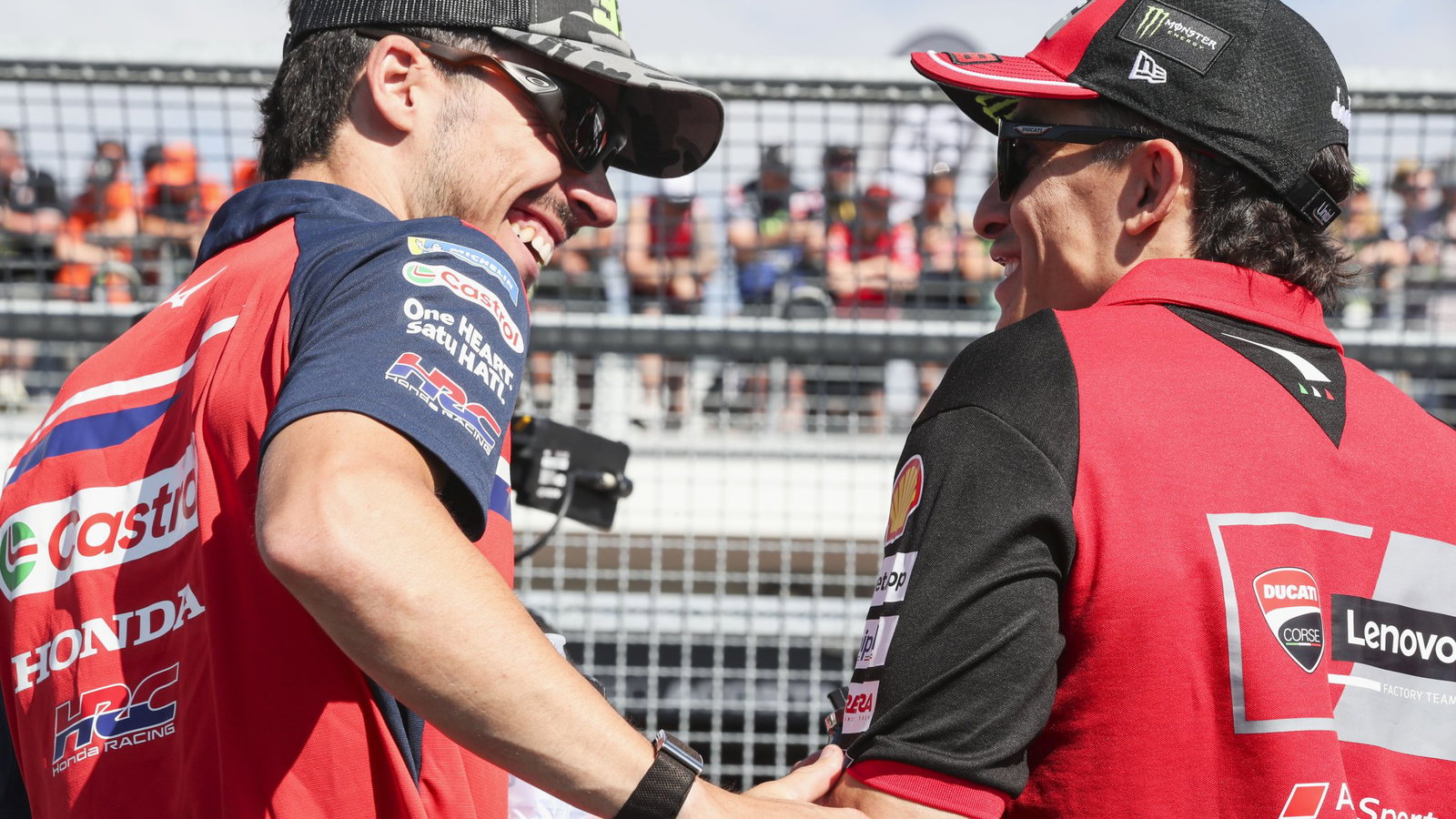 Joan Mir speaks with Marc Marquez in pit lane at the 2026 MotoGP German Grand Prix. Credit: Gold and Goose.