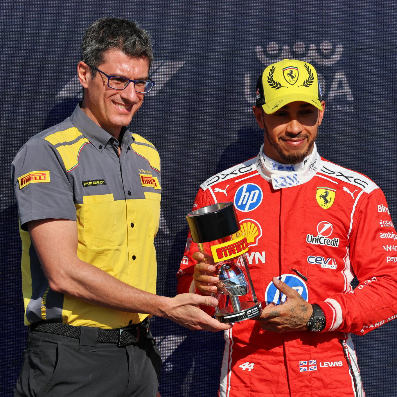 Hamilton is presented with the sprint pole trophy