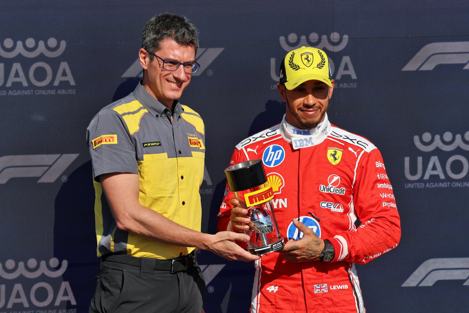Hamilton is presented with the sprint pole trophy 