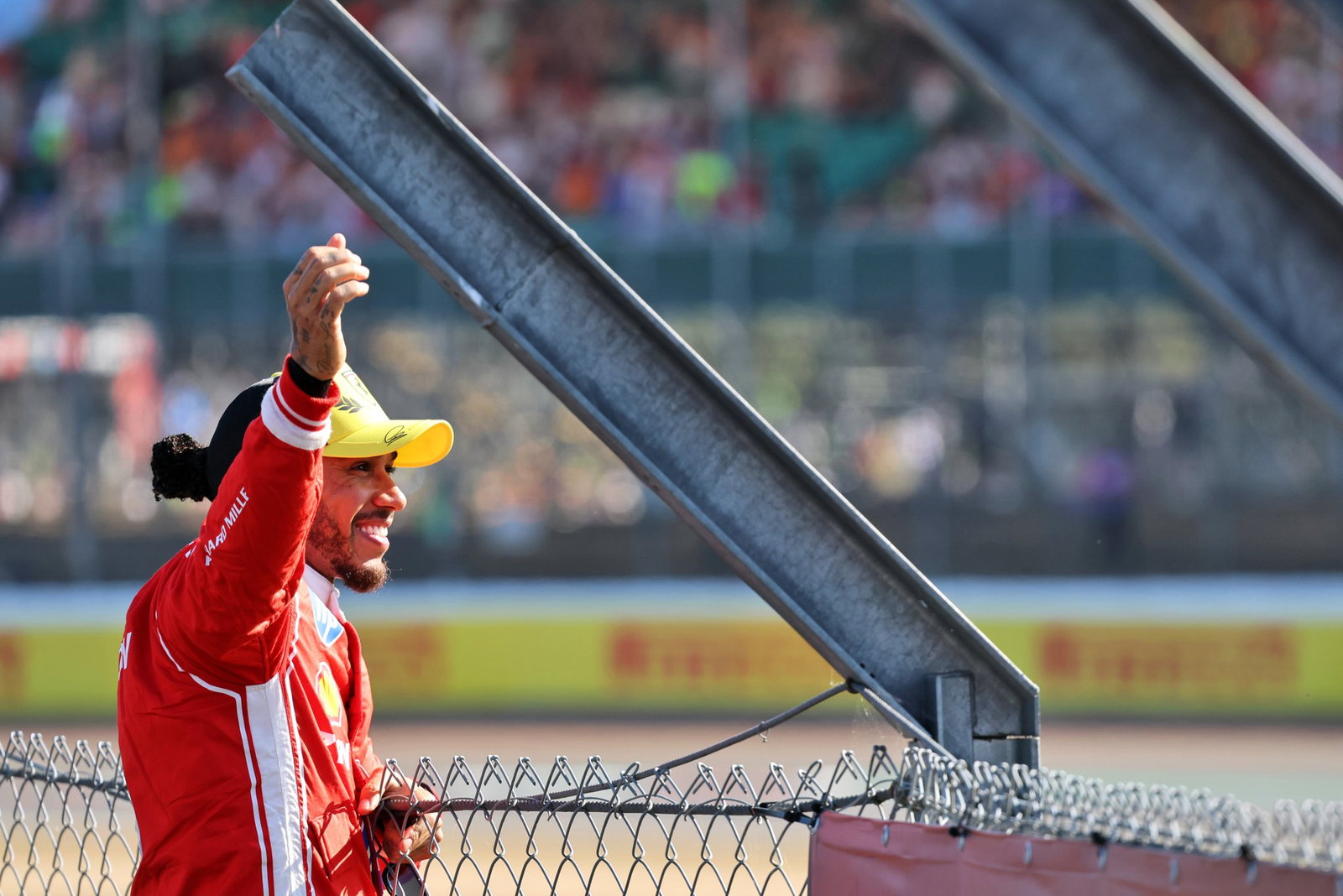 Hamilton waves to his adoring crowd at Silverstone