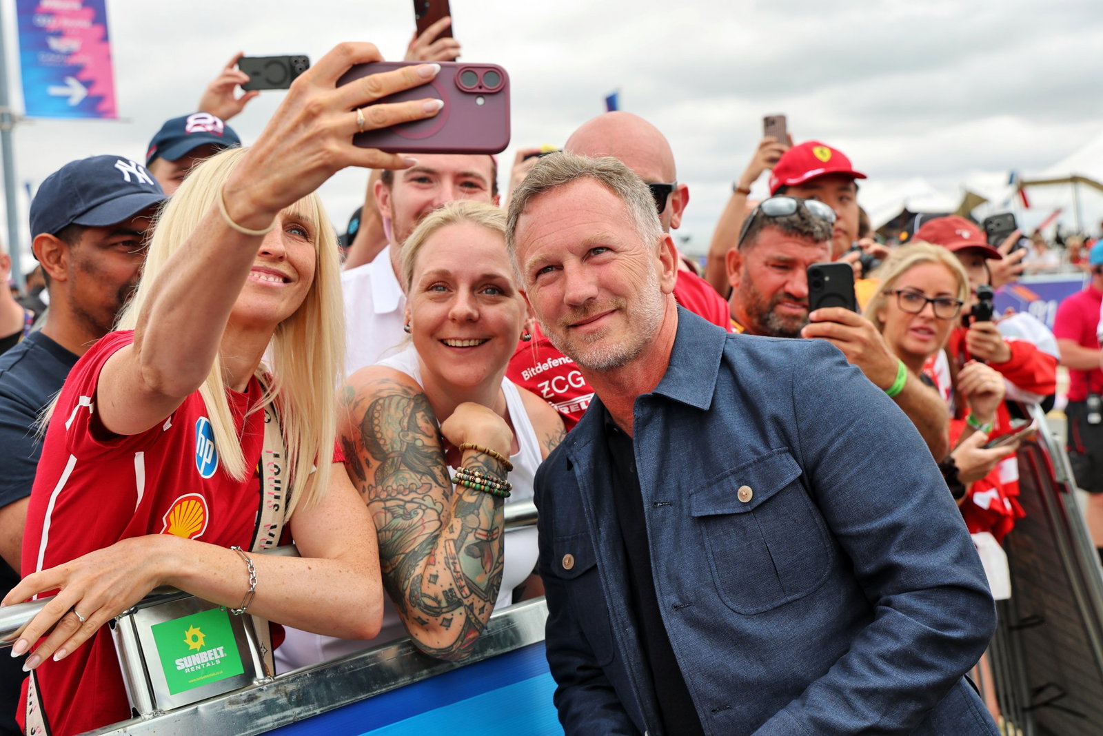 Horner takes a selfie with a fan on his arrival