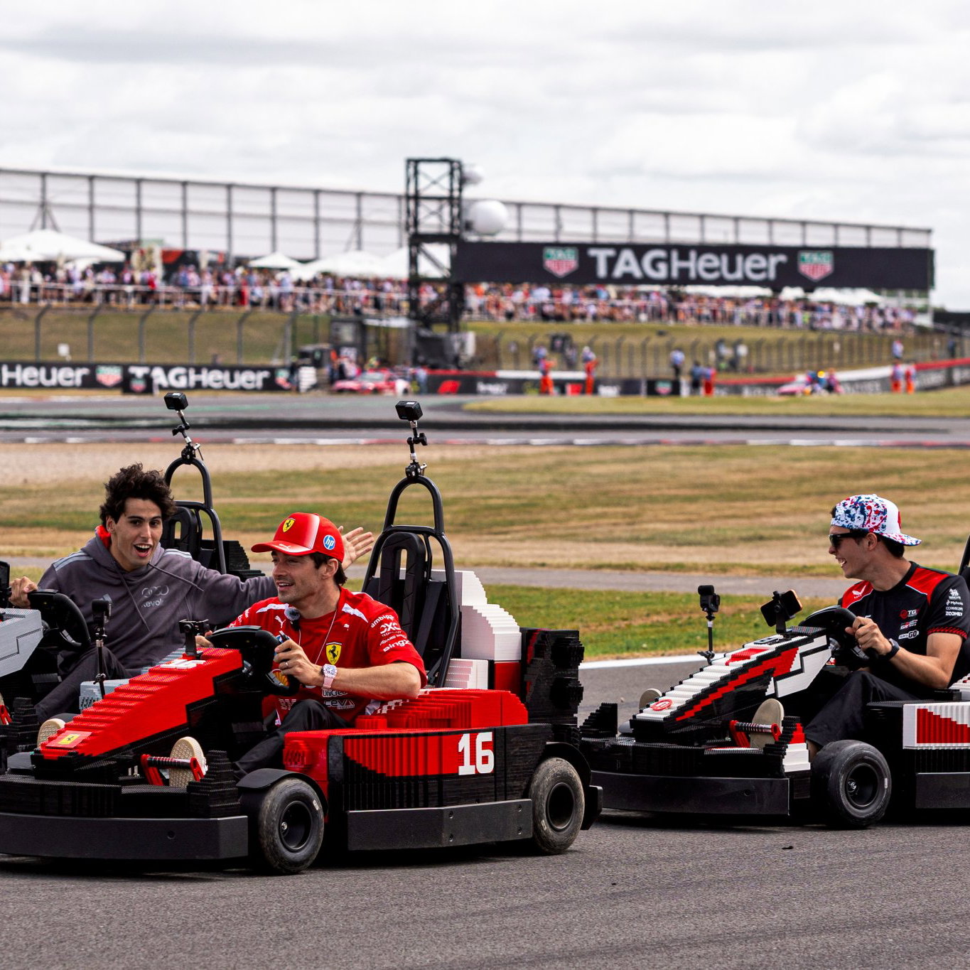Gabriel Bortoleto, Charles Leclerc and Oliie Bearman drive lego cars