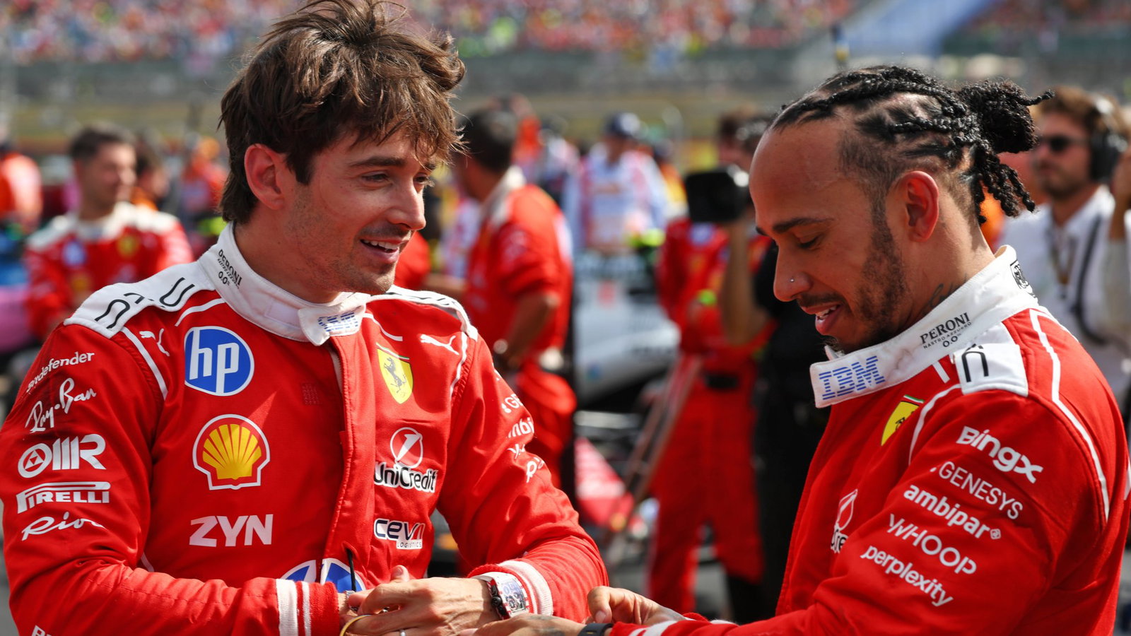 Hamilton puts his Richard Mille watch on after the British Grand Prix