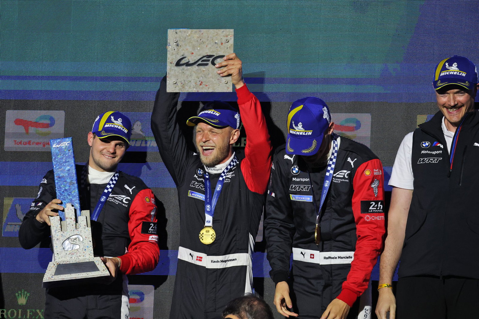 Magnussen celebrates the win with his team-mates