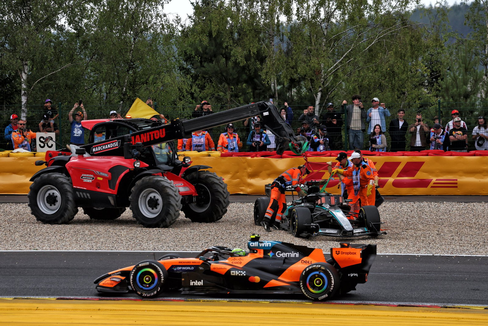 Russell's car is craned away after his collision
