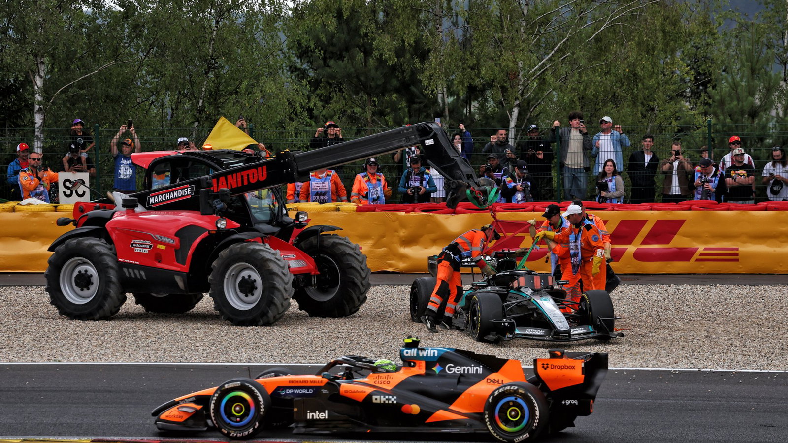 Russell's car is craned away after his collision