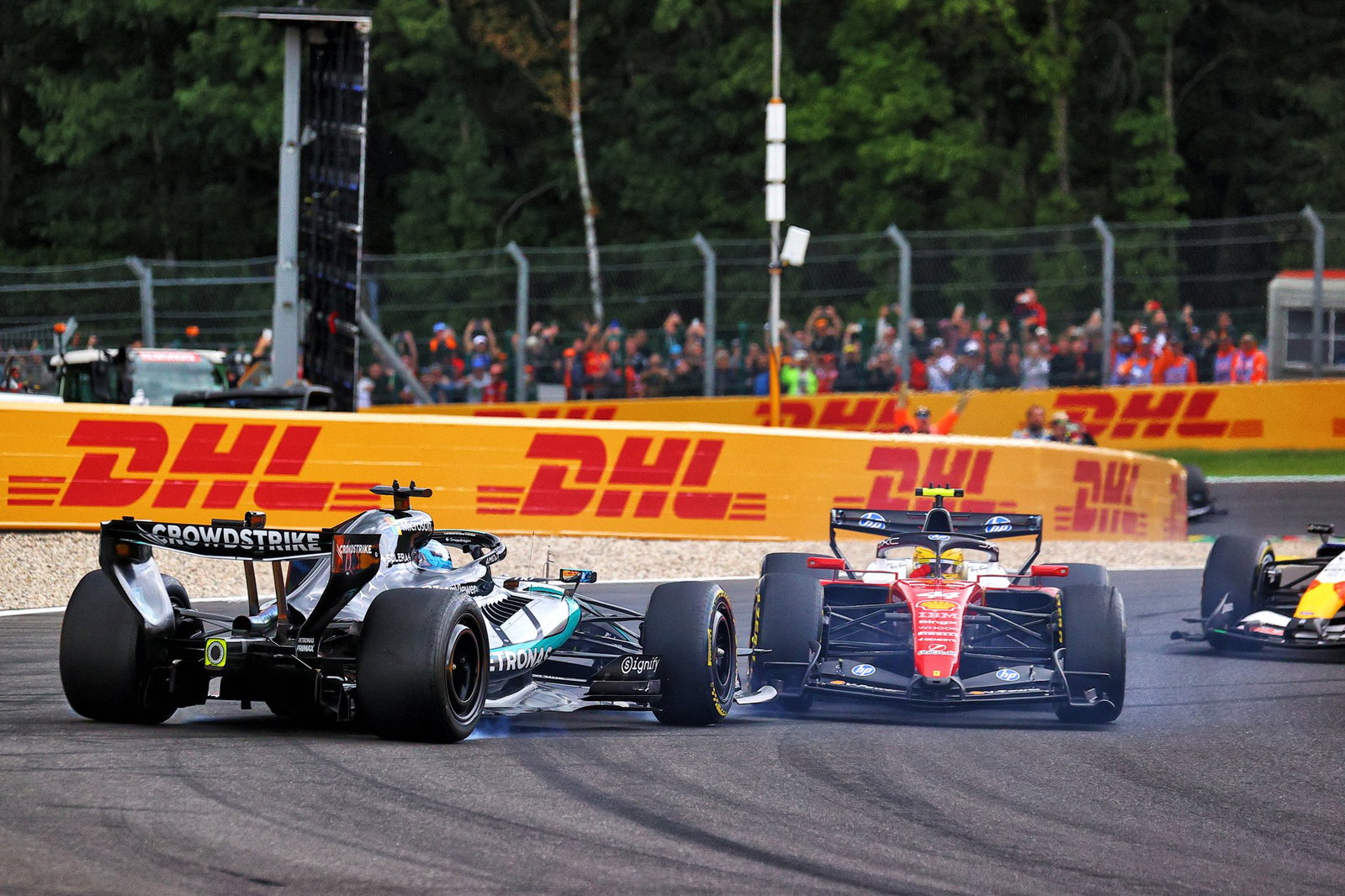 Former team-mates Russell and Hamilton tangled on lap one