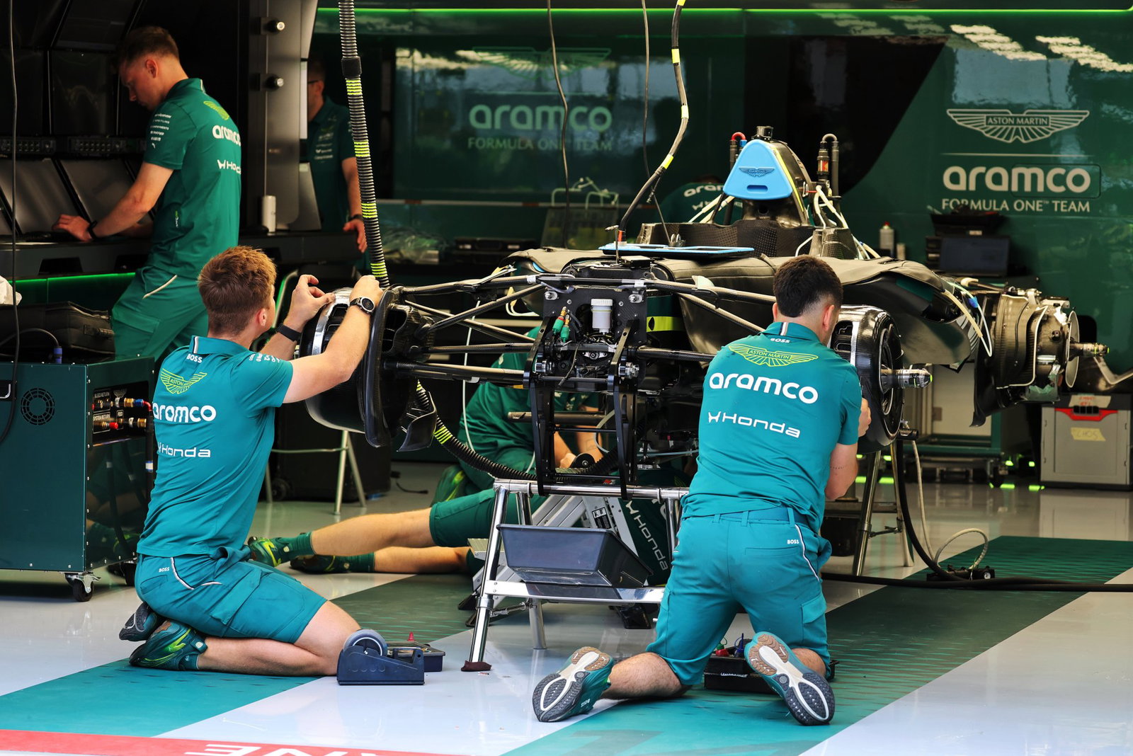 Aston Martin mechanics prepare the AMR26B in the Budapest pitlane