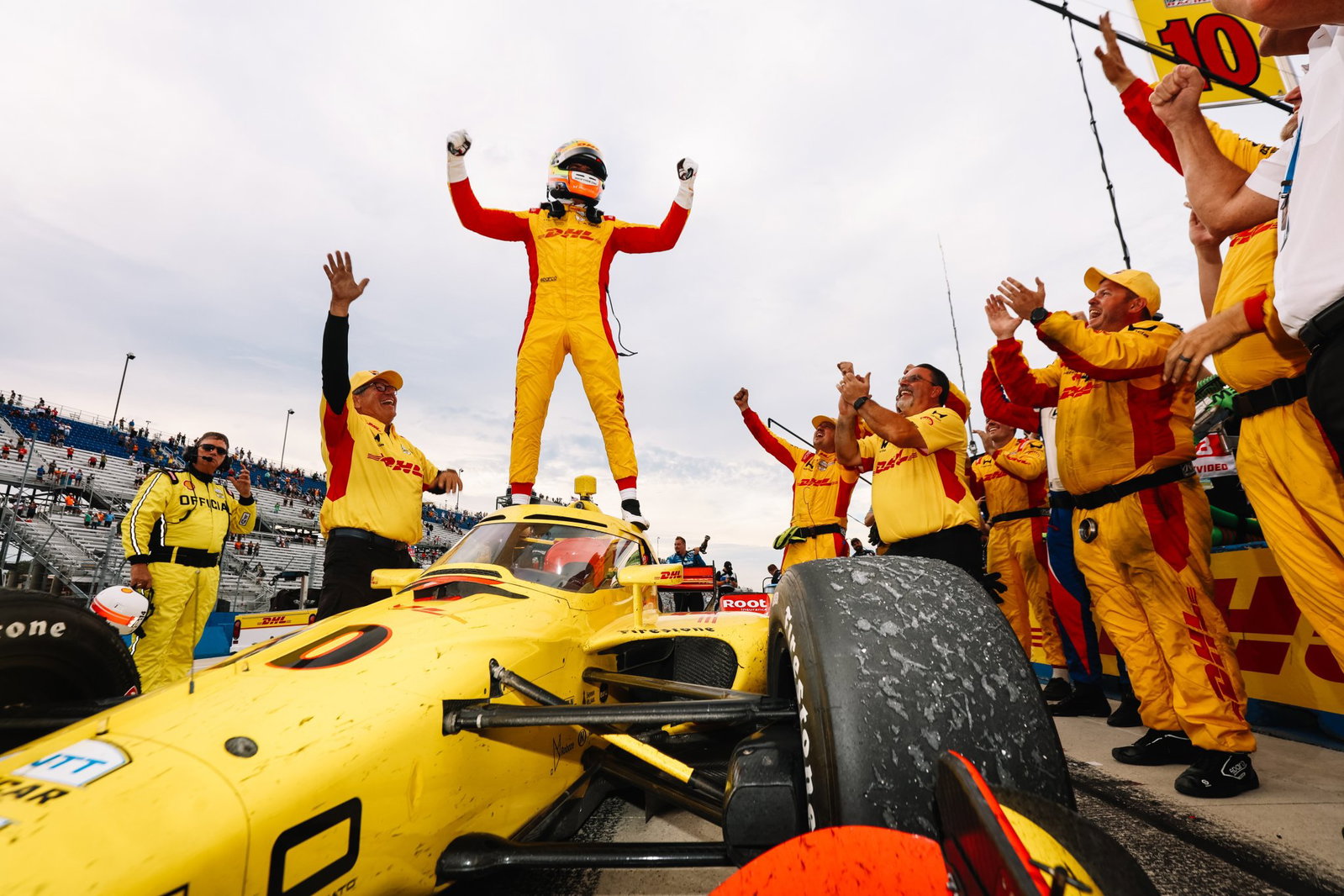 Palou stands atop his car in Victory Lane