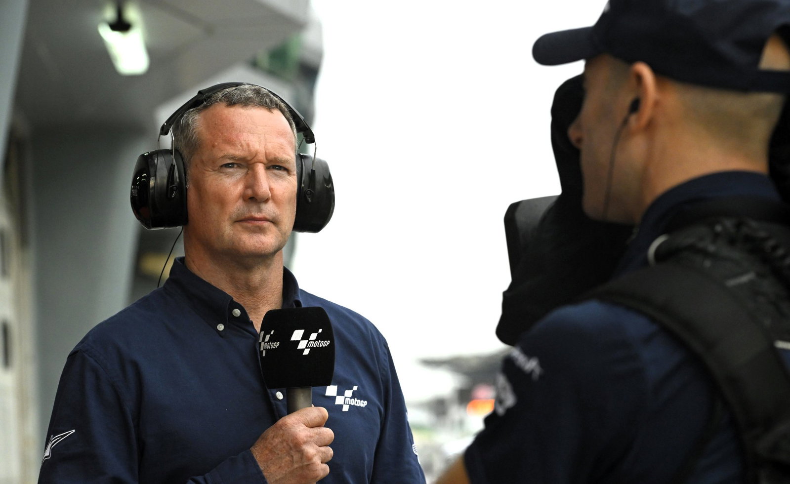 Simon Crafar ready for a live pitlane broadcast, Sepang test 2023.