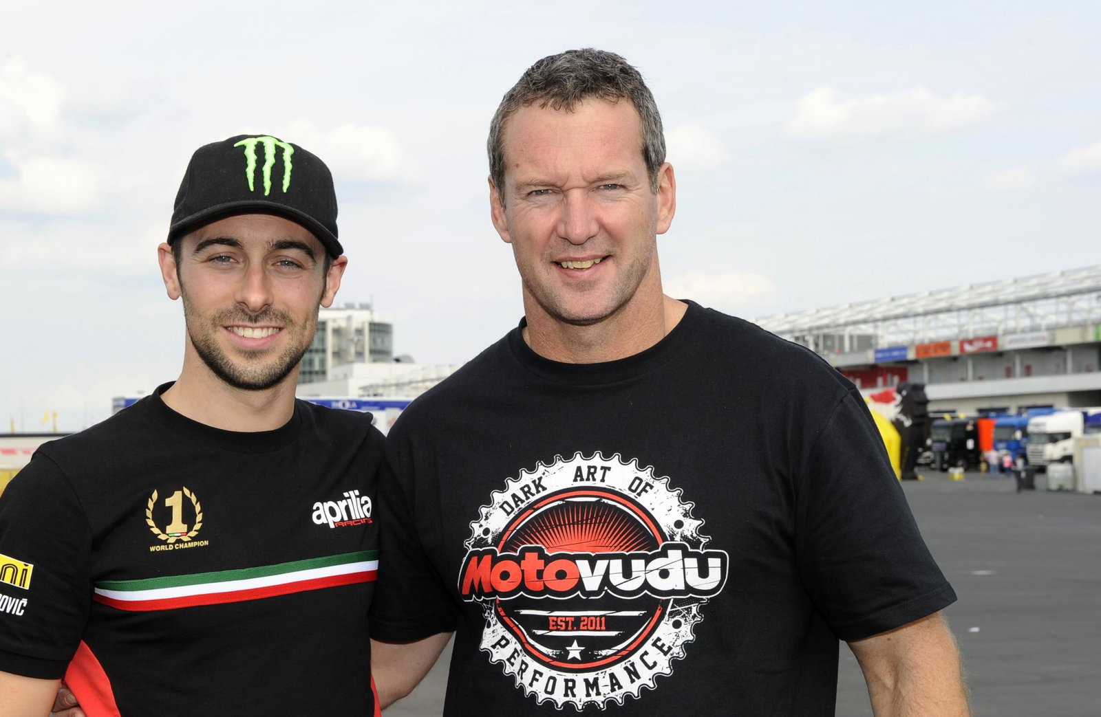 Simon Crafar, wearing Motovudu t-shirt, with Eugene Laverty in 2013.