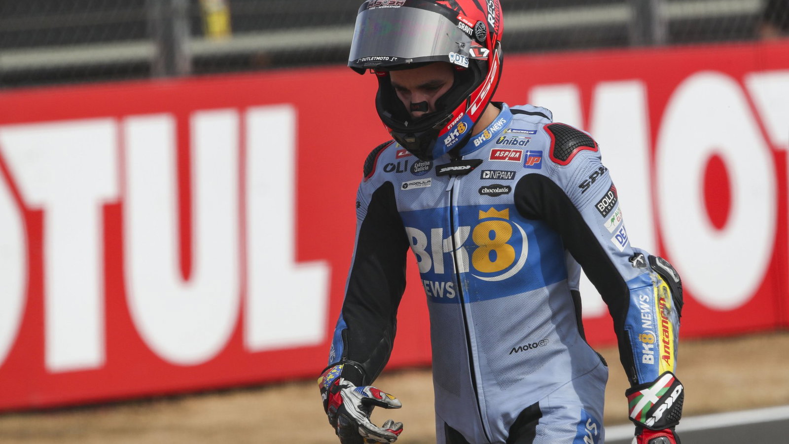 Iker Lecuona walks away after crashing in the Silverstone MotoGP Sprint following contact with Franco Morbidelli.