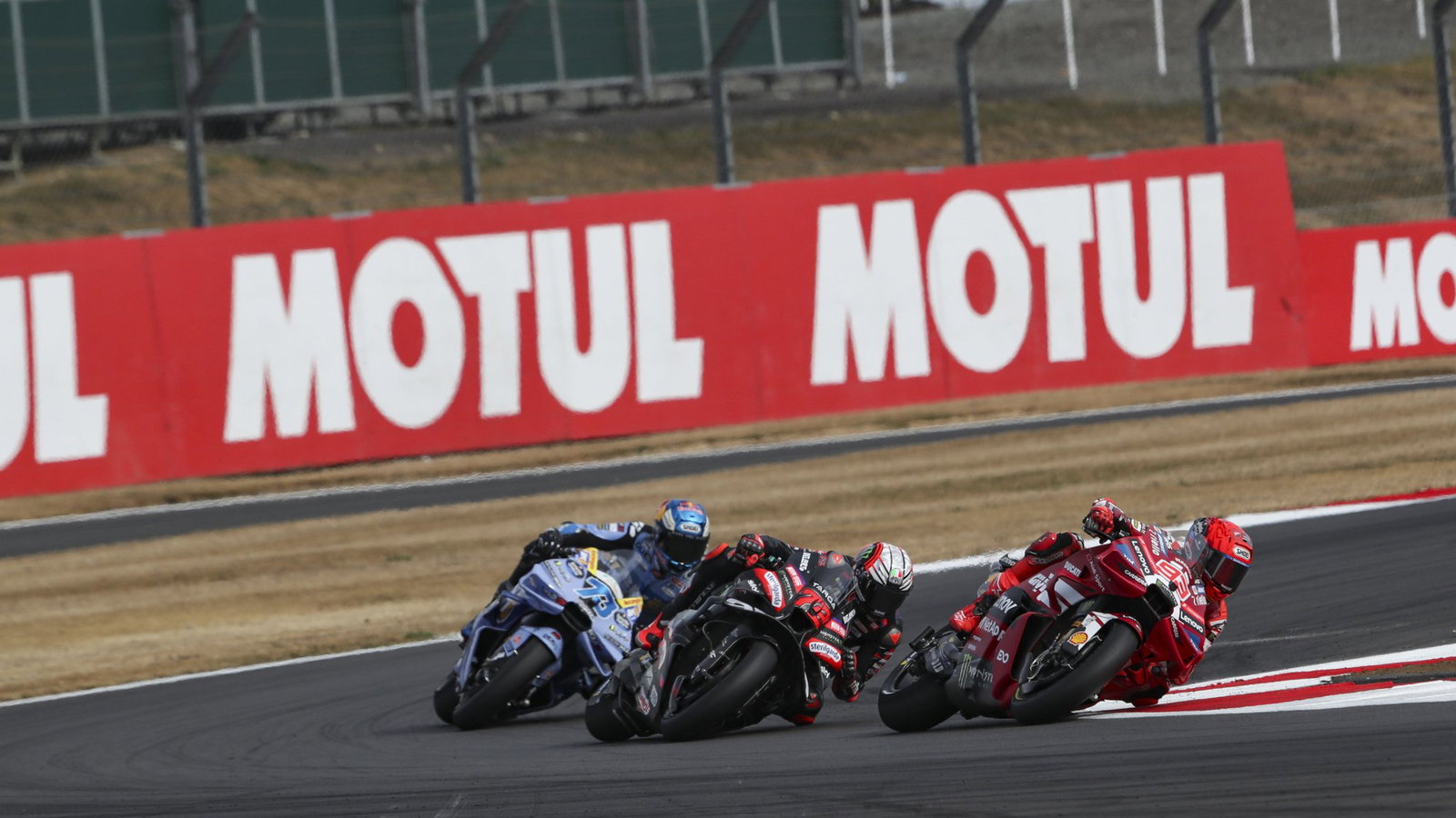 Marc Marquez leads Marco Bezzecchi, Alex Marquez, 2026 MotoGP British Grand Prix. Credit: Gold and Goose.