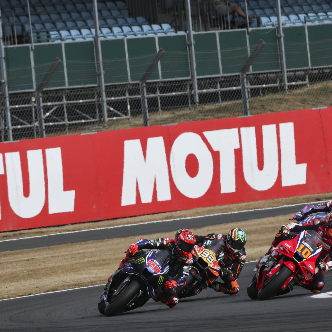 Luca Marini battles Fabio Quartararo, Brad Binder at 2026 MotoGP British Grand Prix. Credit: Gold and Goose.