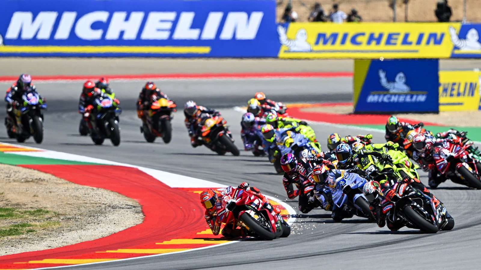Sparks from Marc Marquez's Ducati as ride-height device stays down at Turn 2. 2026 Aragon MotoGP. 