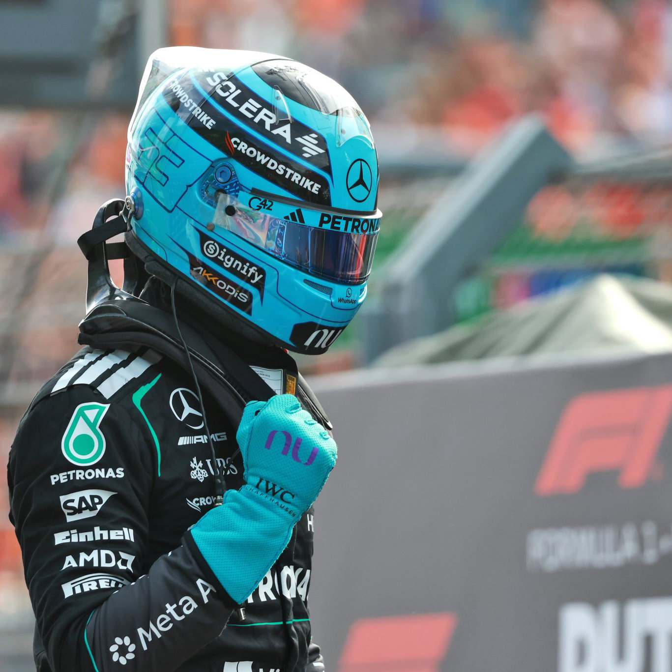 Russell celebrates his sprint pole in parc ferme 