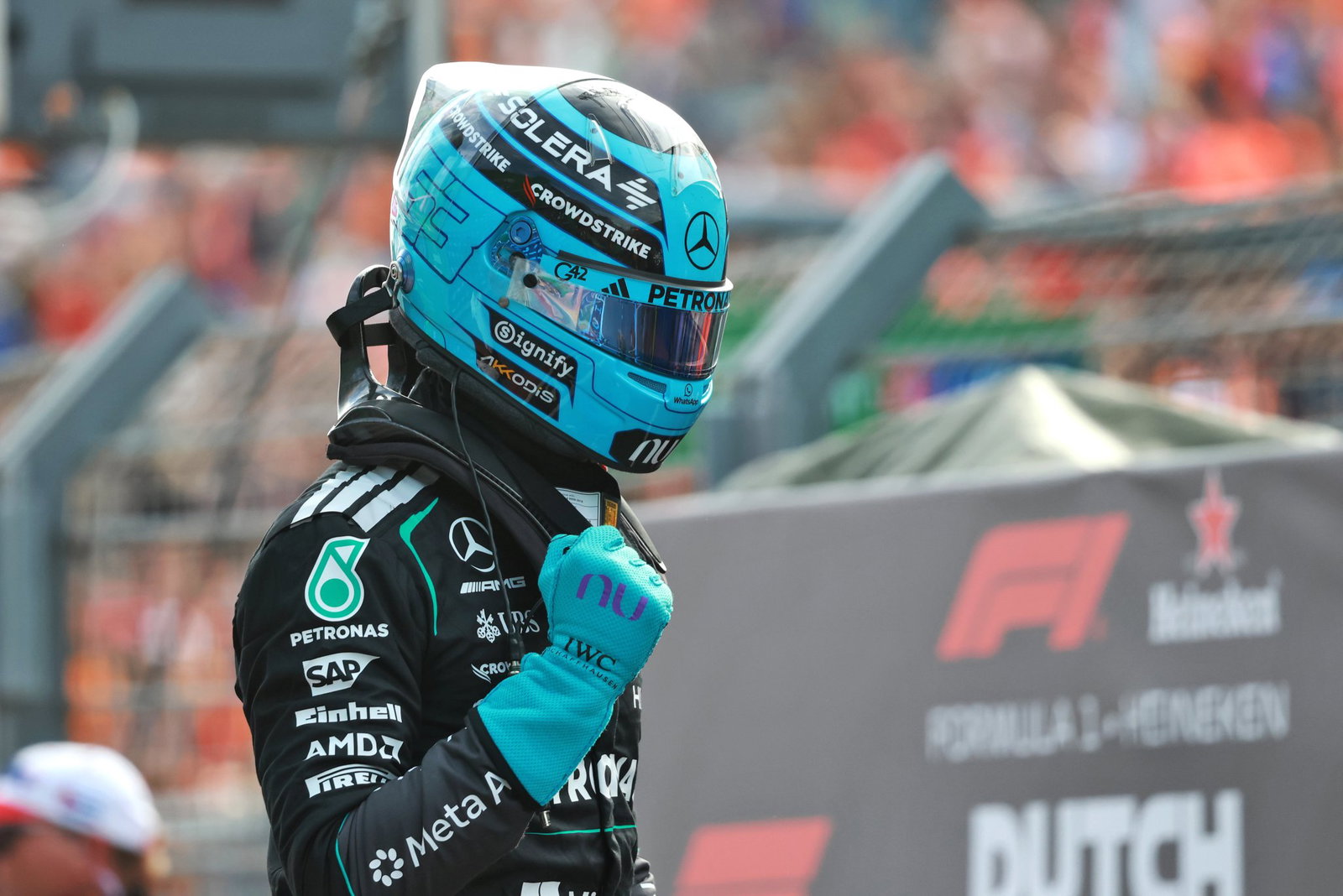 Russell celebrates his sprint pole in parc ferme