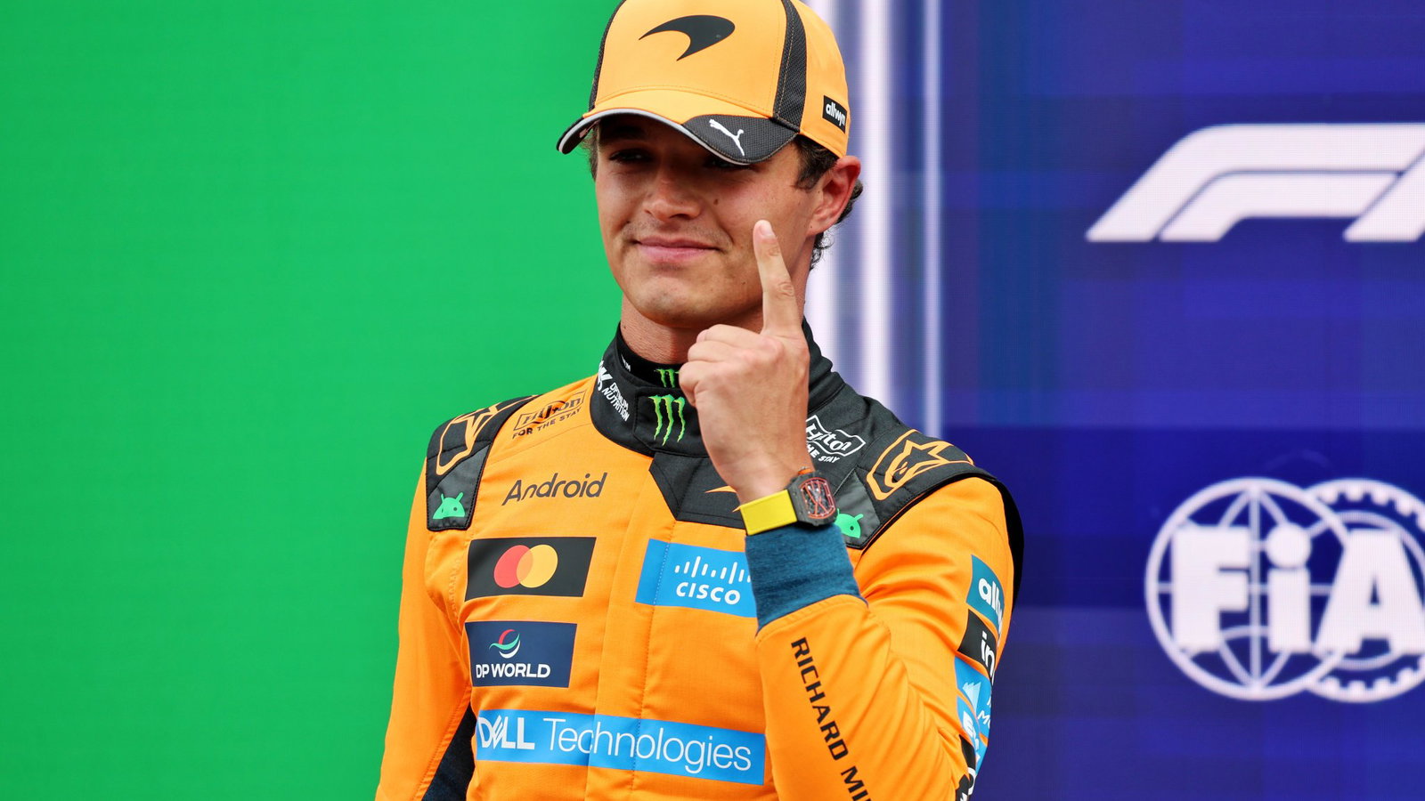 Lando Norris celebrates taking his second pole of the season