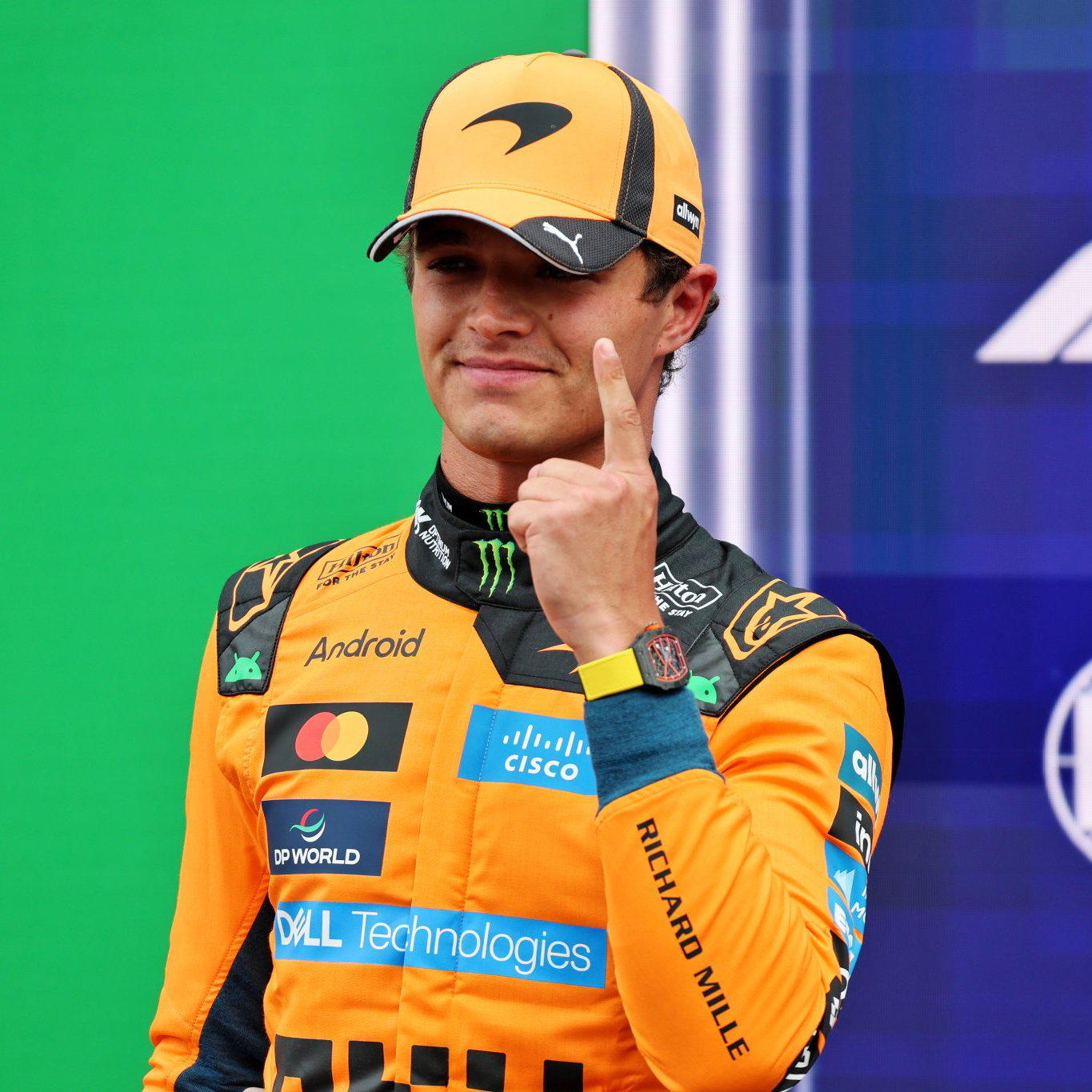 Lando Norris celebrates taking his second pole of the season