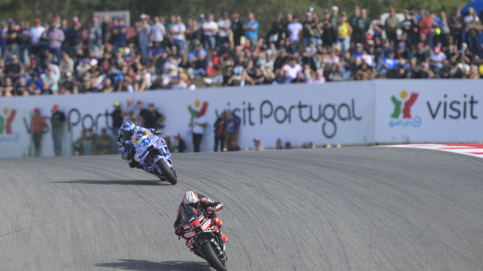 Marco Bezzecchi leads Alex Marquez, 2025 MotoGP Portuguese Grand Prix. Credit: Gold and Goose.
