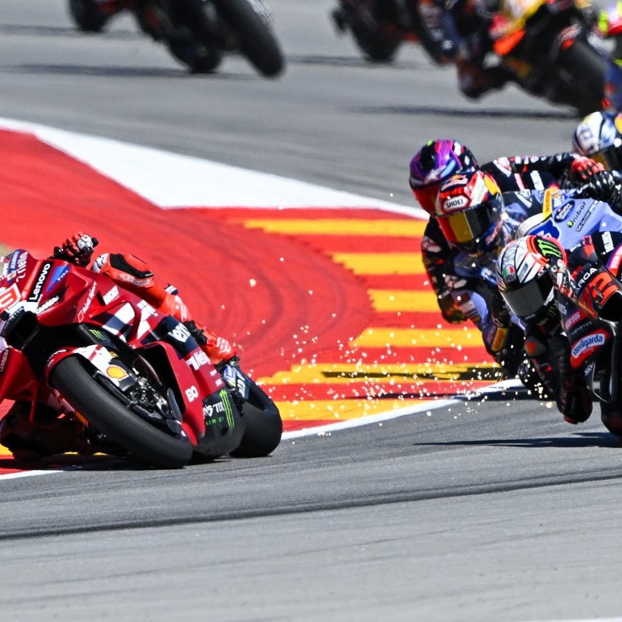 Sparks as Marc Marquez's ride height device remains down at Turn 2, 2026 Aragon MotoGP.