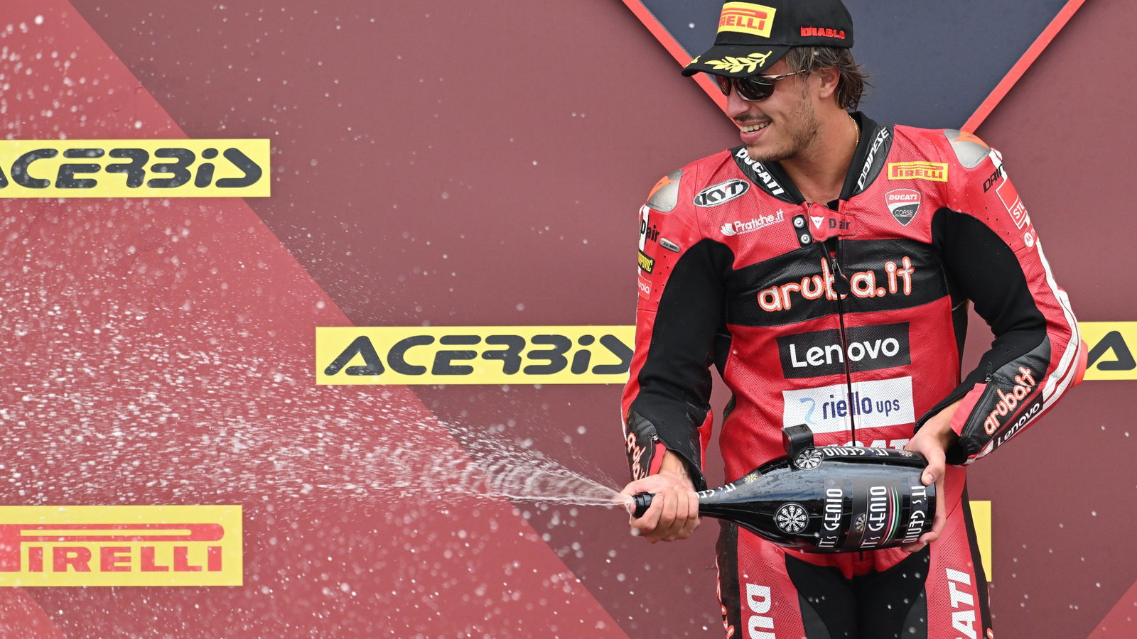 Nicolo Bulega on the French WorldSBK Race 2 podium after beating Iker Lecuona.