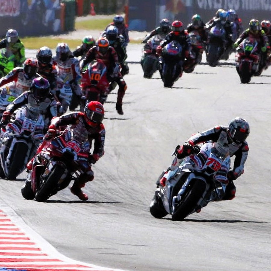 Bezzecchi leads Marquez, opening lap, 2026 Misano MotoGP. 