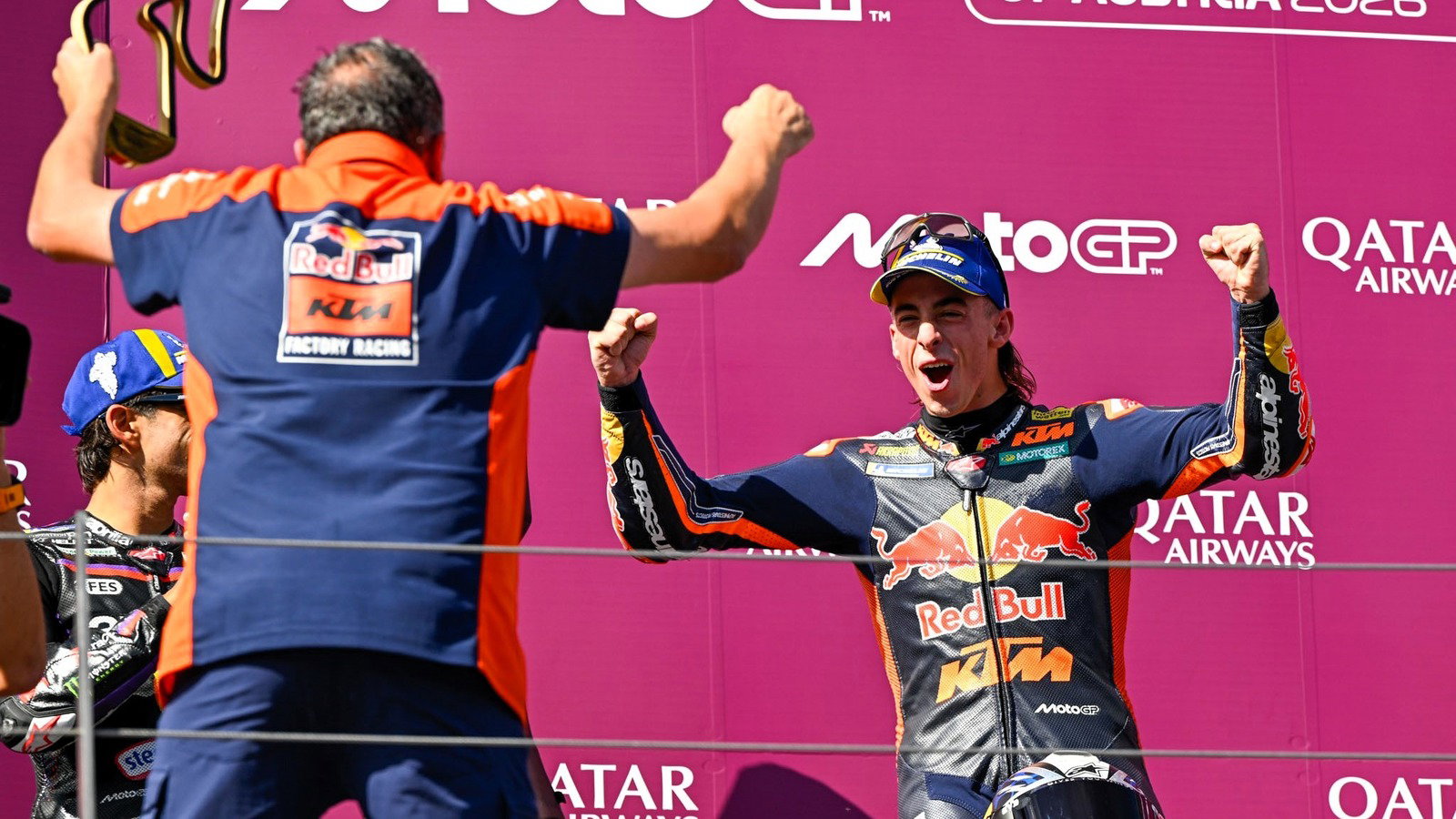 Pedro Acosta and Paul Trevathan celebrate, 2026 Red Bull Ring MotoGP.