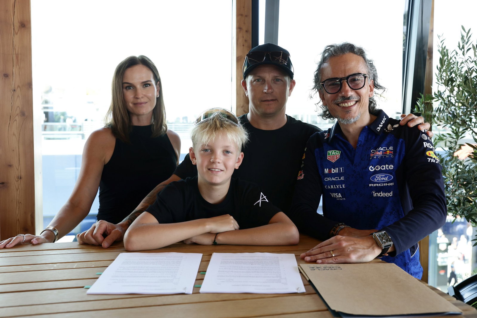 The Raikkonen family with Red Bull team principal Laurent Mekies