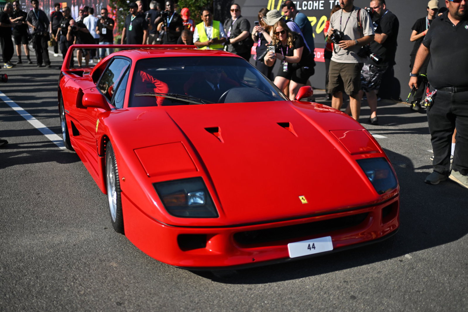 Lewis Hamilton arrives in his Ferrari F40