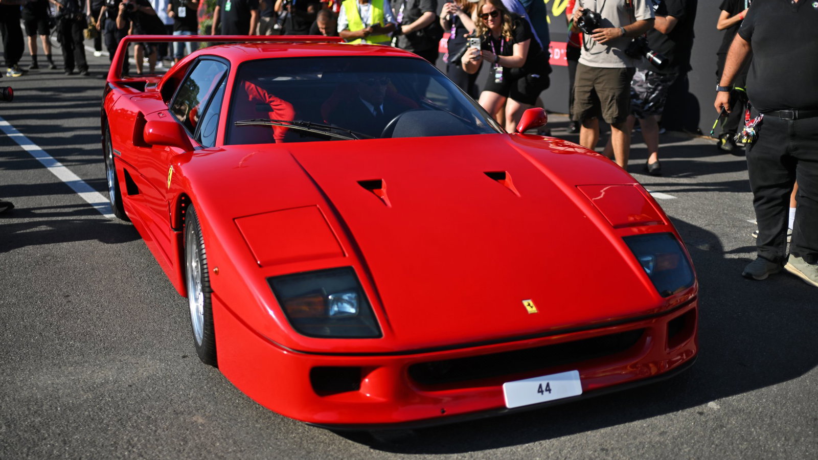 Lewis Hamilton arrives in his Ferrari F40