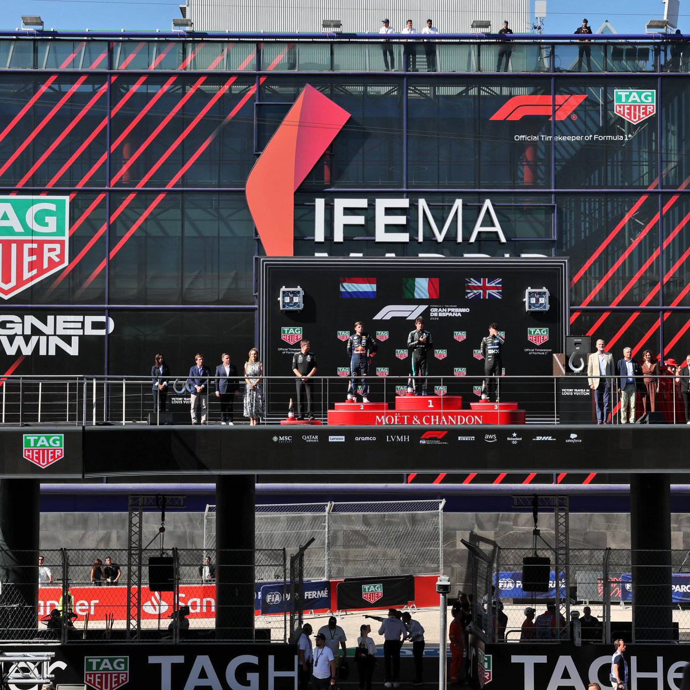 The photographer was trying to reach the F1 podium after the Spanish GP