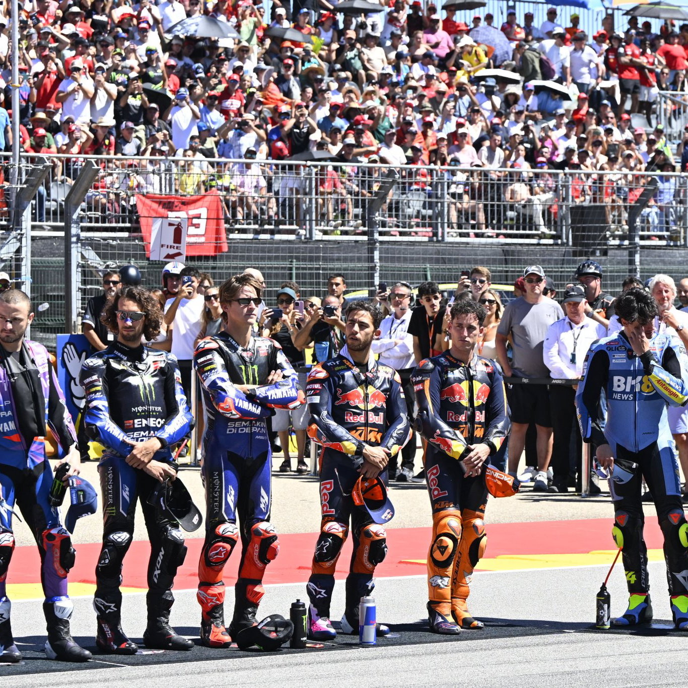 MotoGP riders assembled on the grid
