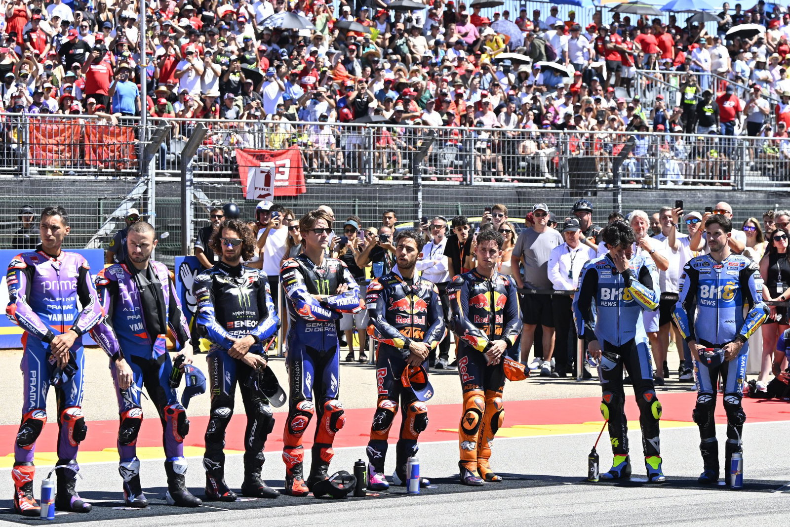 MotoGP riders assembled on the grid