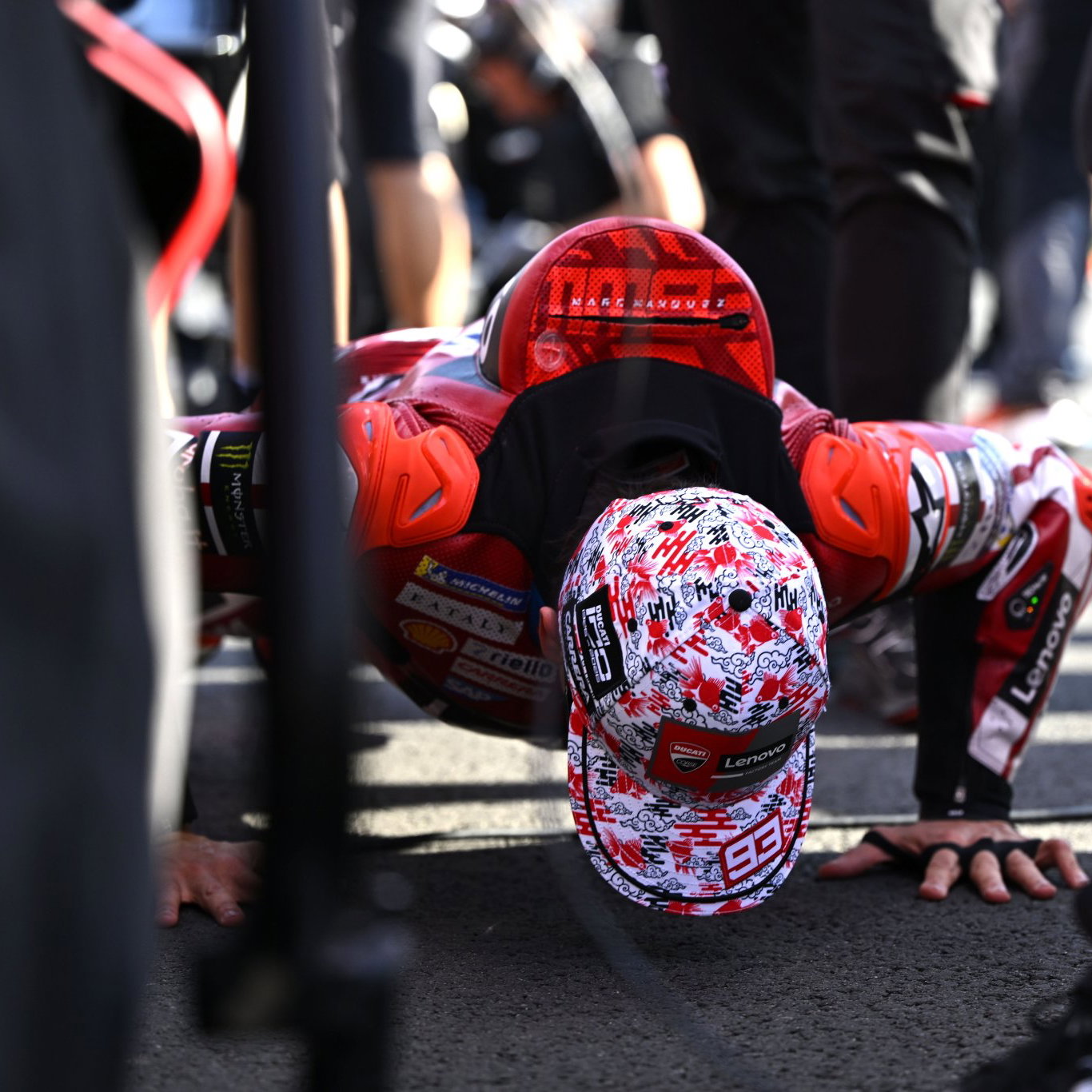 Marc Marquez does push-ups on the grid before 2026 Japanese MotoGP Sprint. Credit: Gold and Goose.