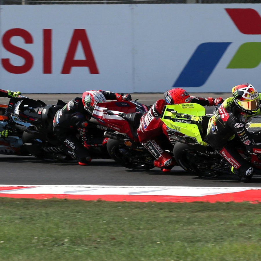 Fabio di Giannantonio, Marc Marquez overtake Marco Bezzecchi and Raul Fernandez at turn 1 of the Sprint, 2026 Indonesian MotoGP. 