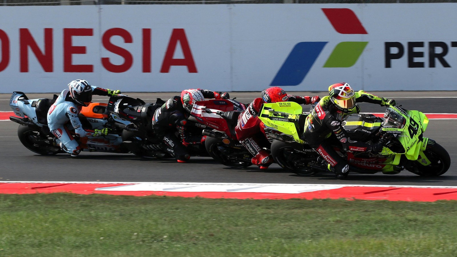 Fabio di Giannantonio, Marc Marquez overtake Marco Bezzecchi and Raul Fernandez at turn 1 of the Sprint, 2026 Indonesian MotoGP. 