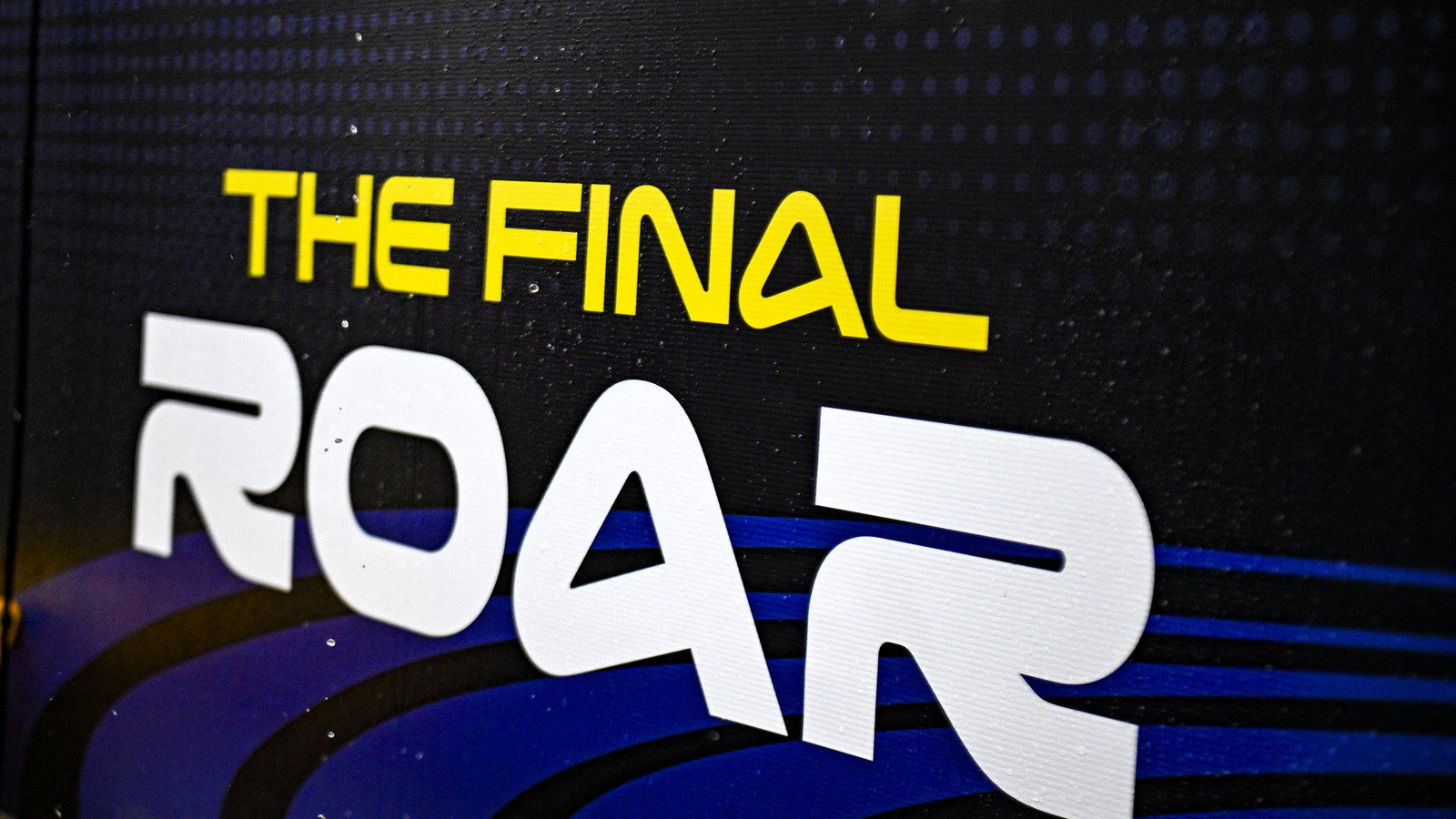 Rain drops on Phillip Island The Final Roar sign, 2026 Australian MotoGP. 