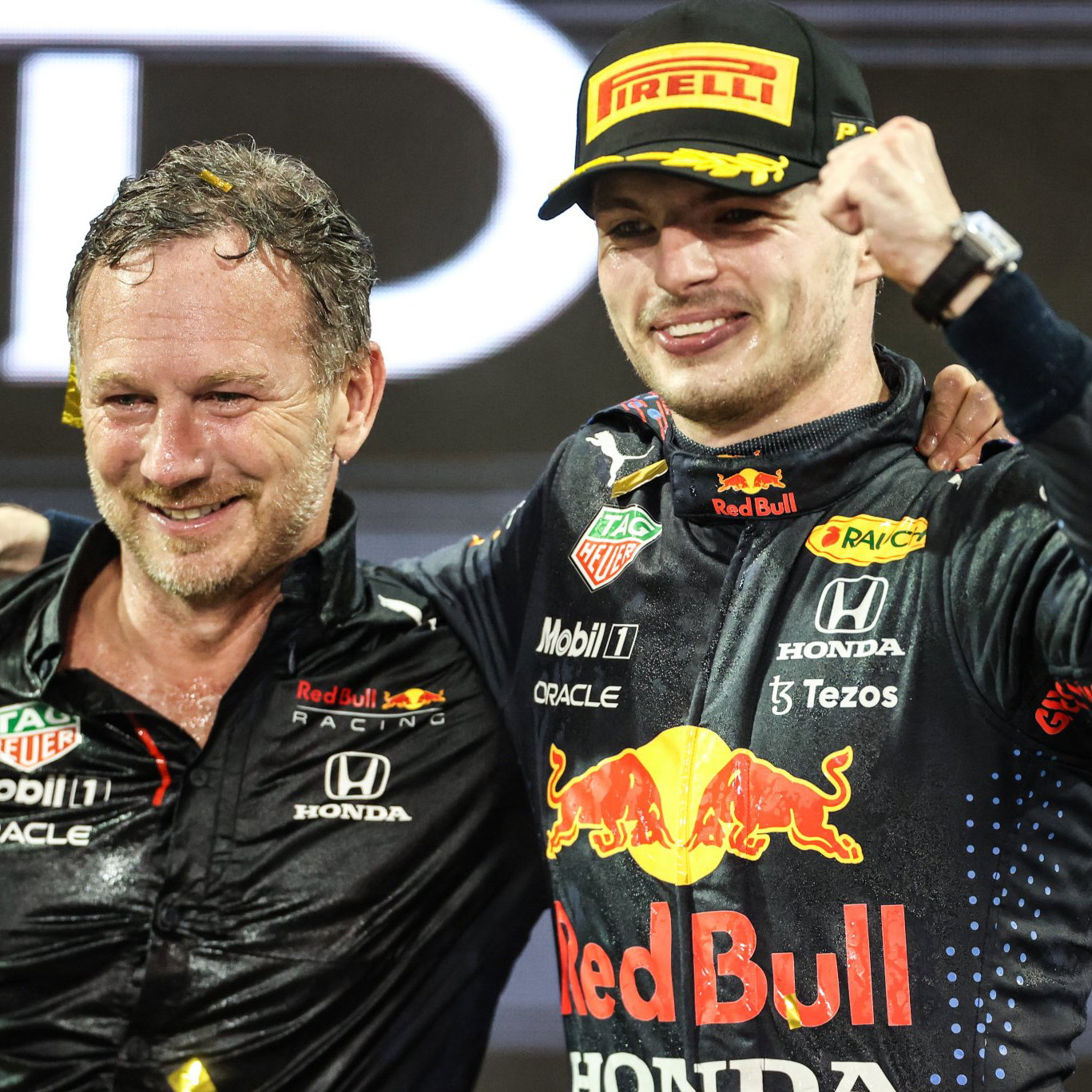Christian Horner and Max Verstappen celebrate on the Abu Dhabi podium