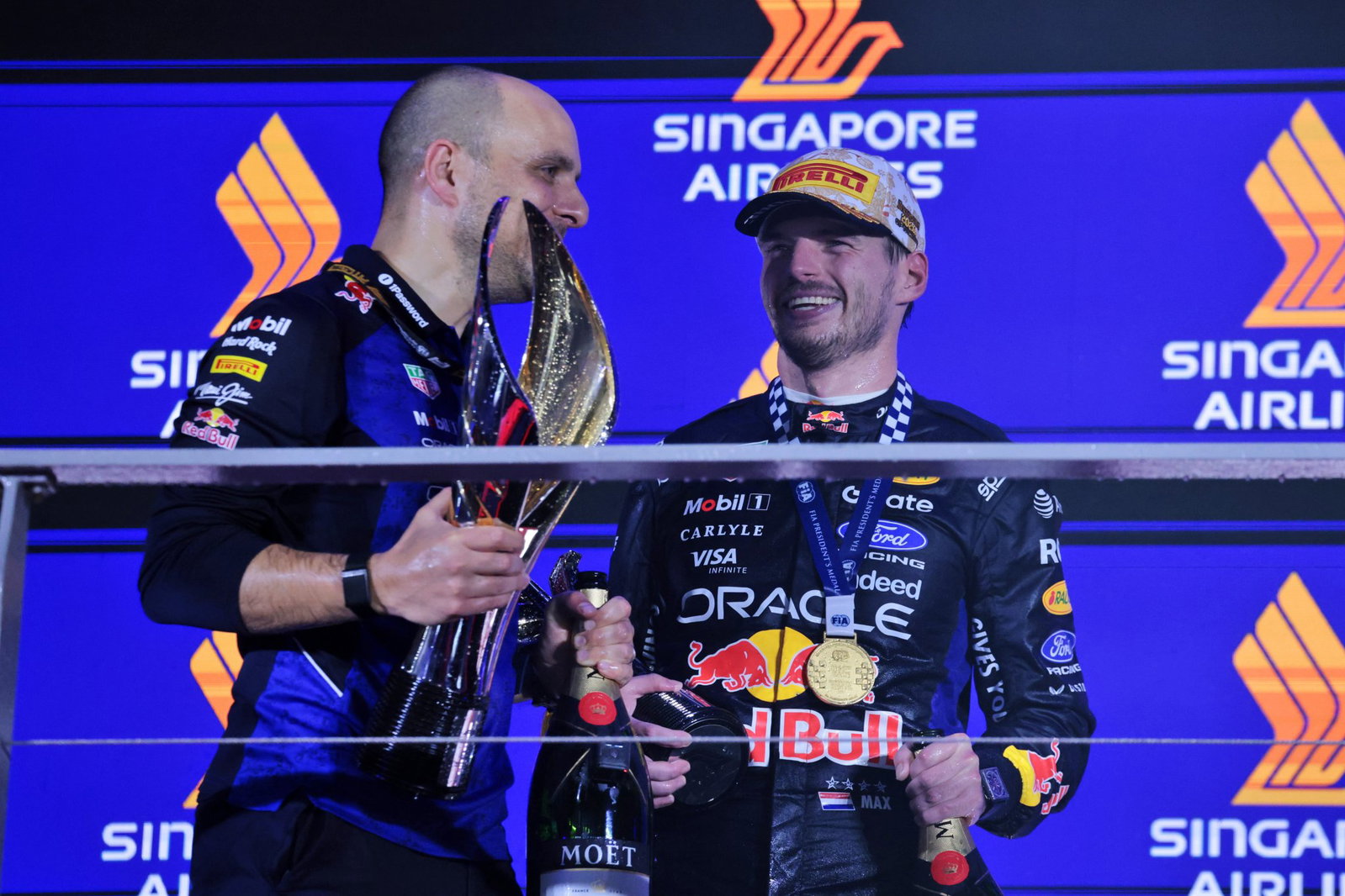 Verstappen on the podium with race engineer Gianpiero Lambiase