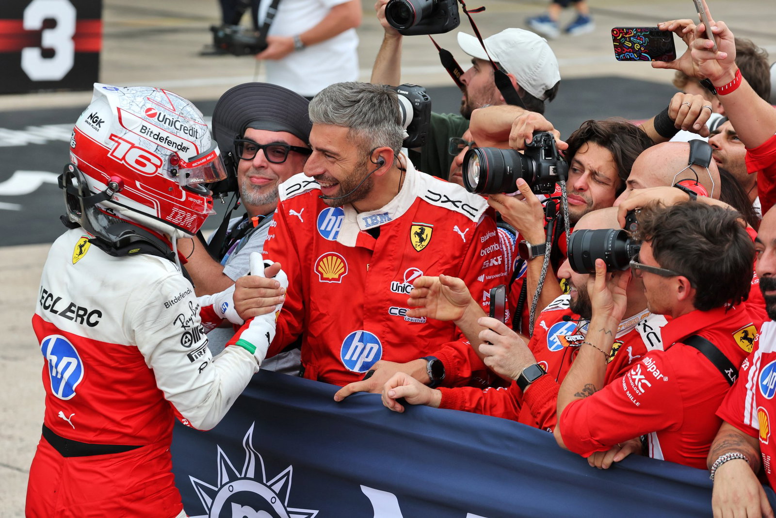 Leclerc celebrates with Ferrari in parc ferme