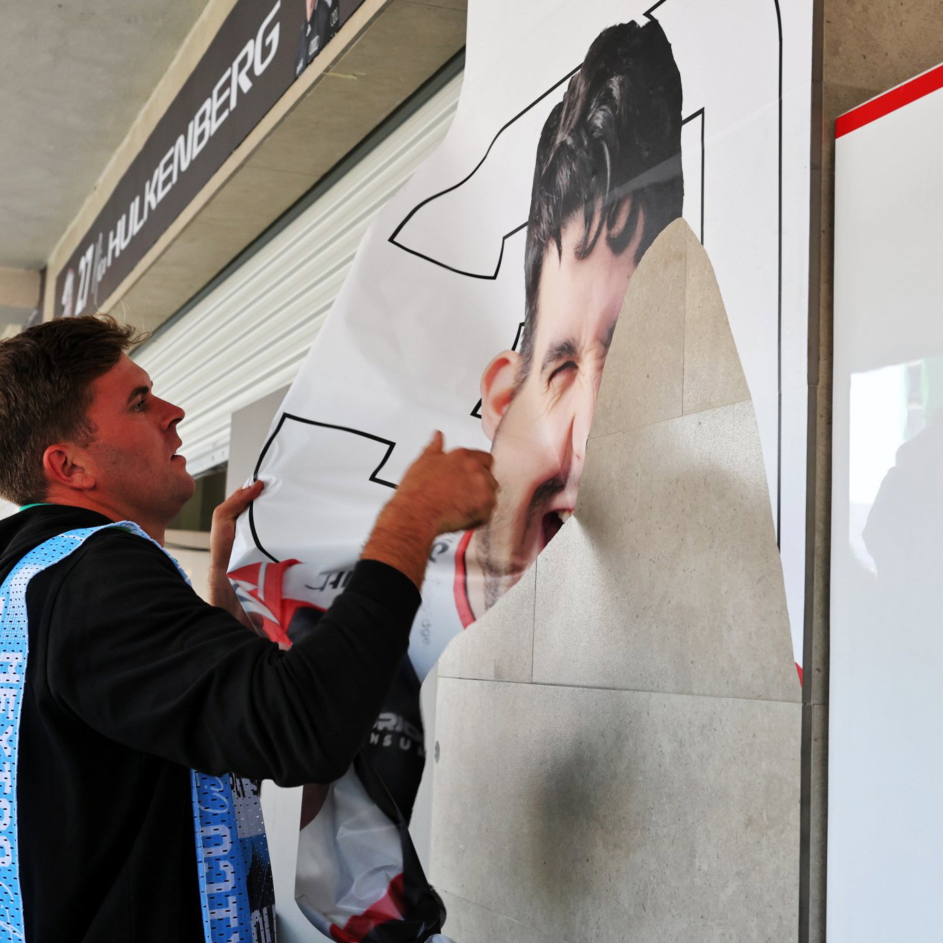 Esteban Ocon's sticker is removed from the Haas garage