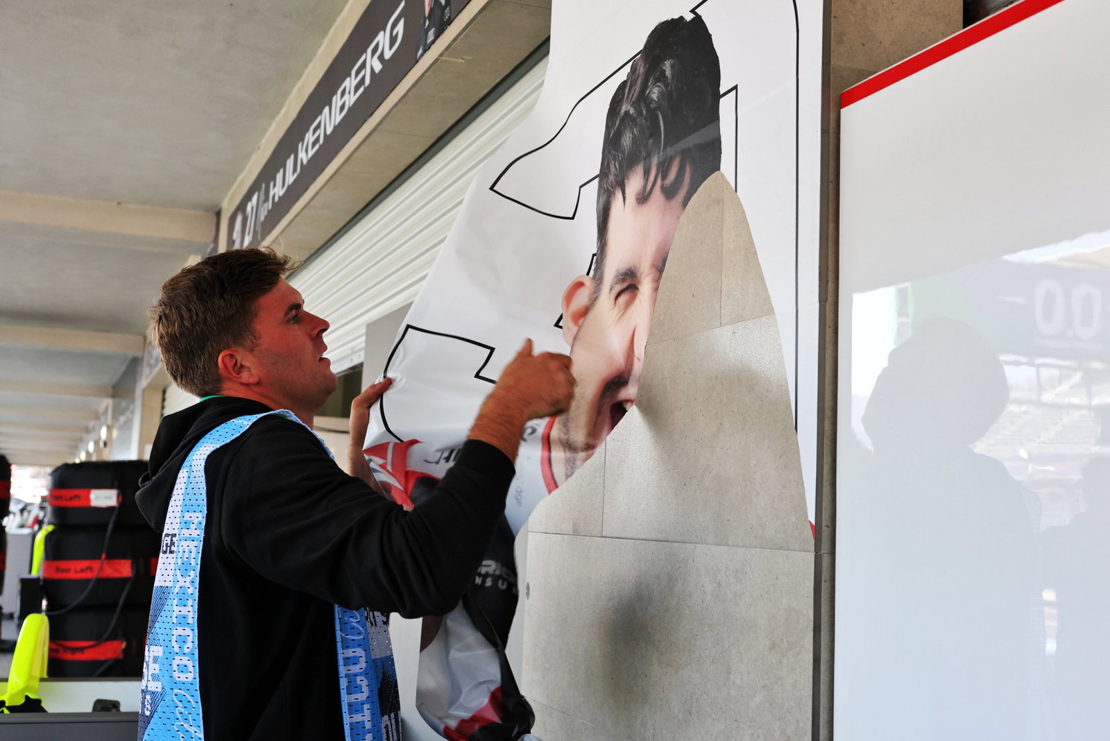 Esteban Ocon's sticker is removed from the Haas garage
