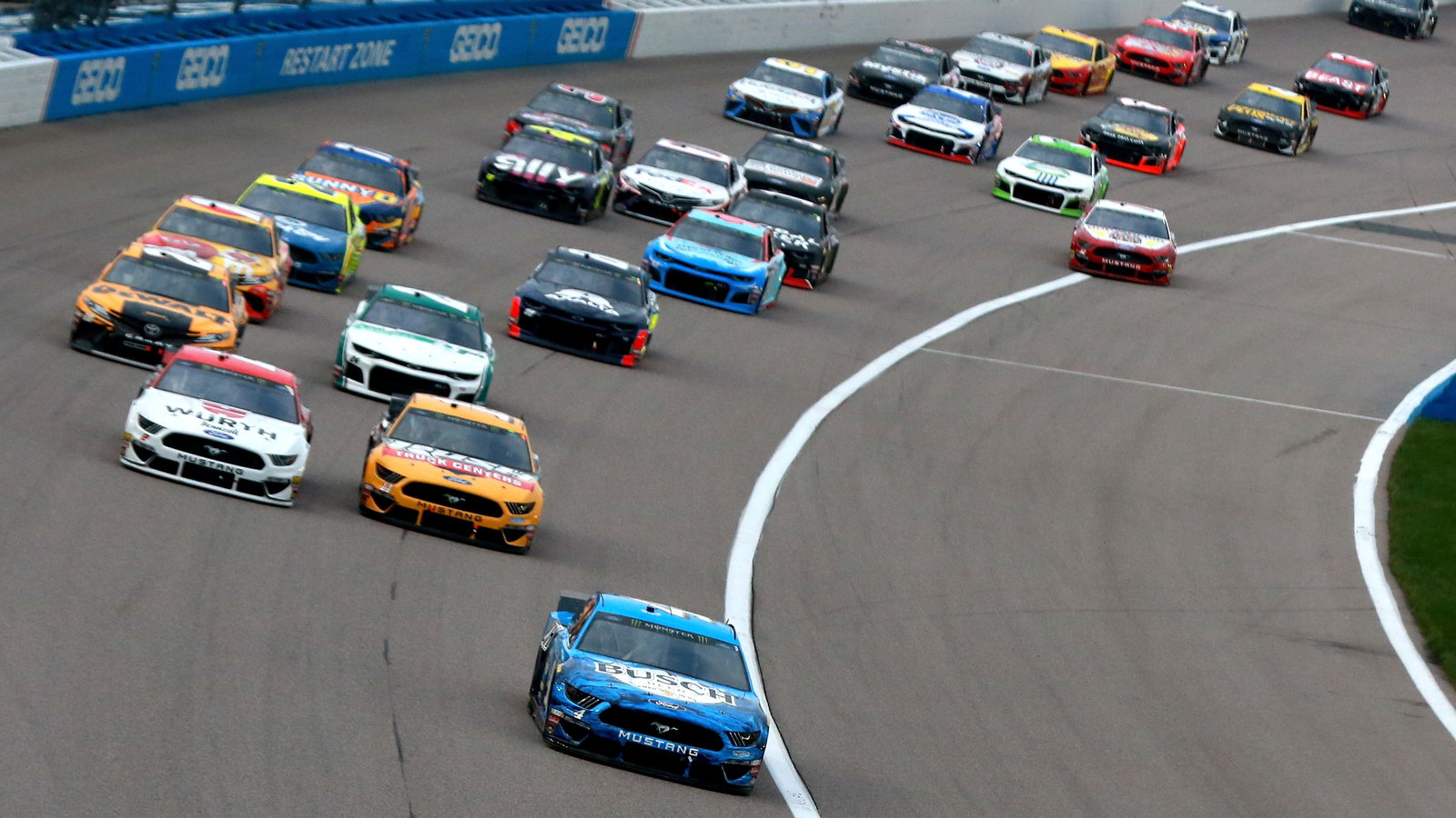 Harvick blasts way to opening Kansas stage win