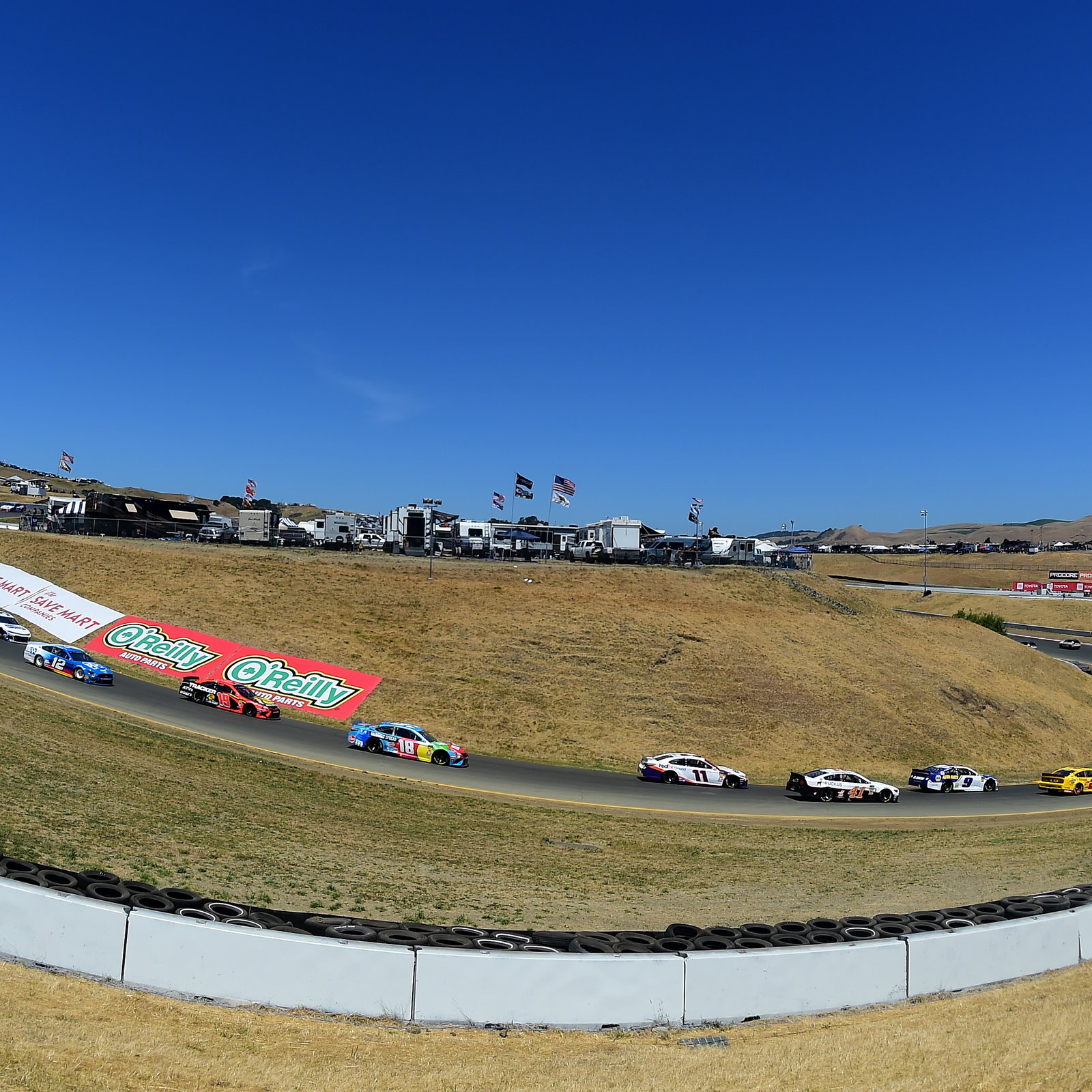 Martin Truex, Jr fends off teammate Kyle Busch for Sonoma race win