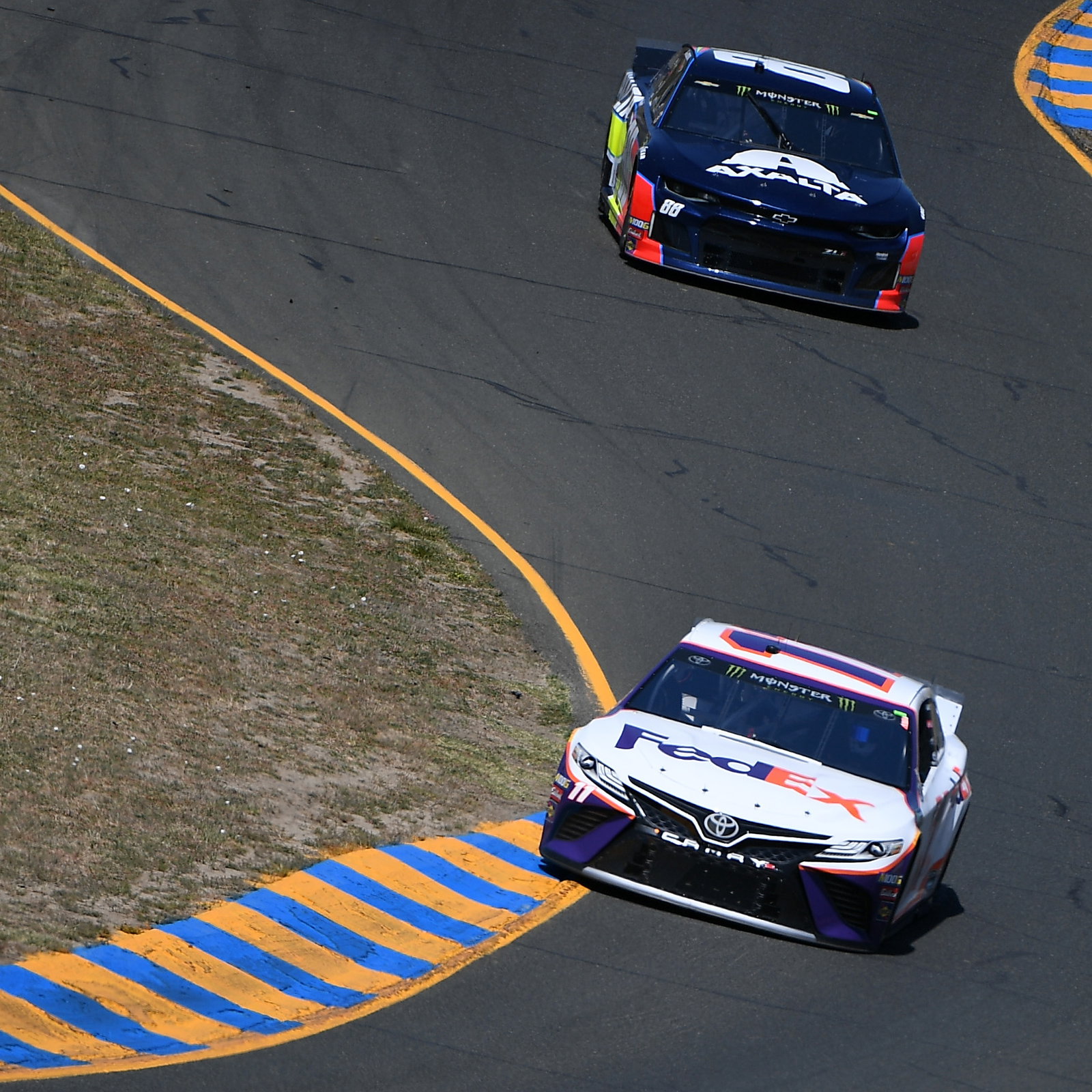 Martin Truex, Jr fends off teammate Kyle Busch for Sonoma race win