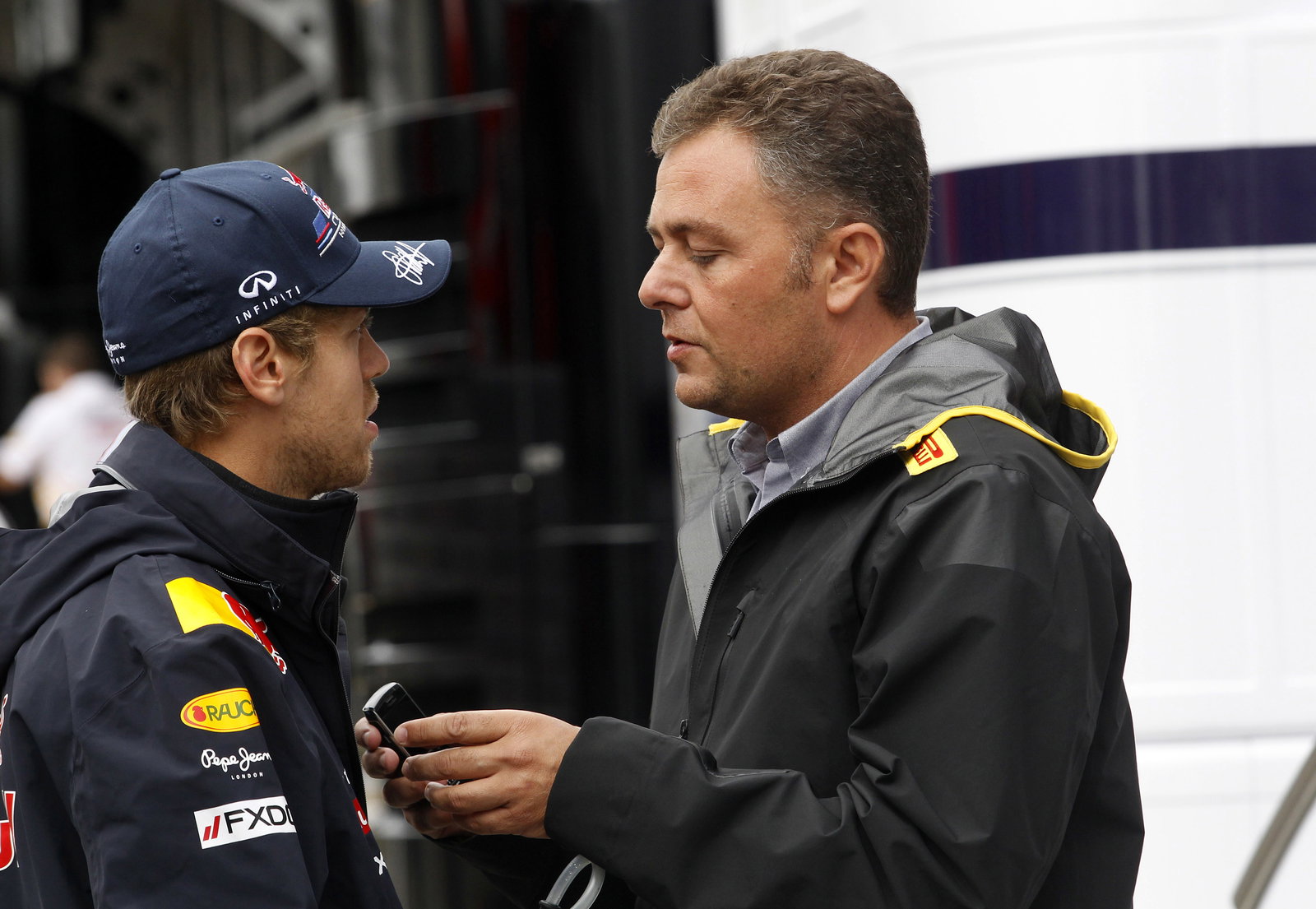 28.08.2011- Sebastian Vettel (GER), Red Bull Racing, RB7 and Mario Isola (ITA), Sporting Director Pi