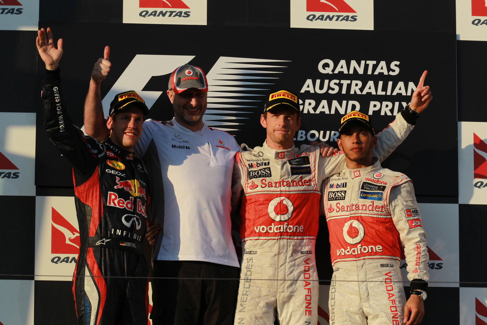 2nd place Sebastian Vettel (GER), Red Bull Racing with 1st place Jenson Button (GBR), McLaren Merced